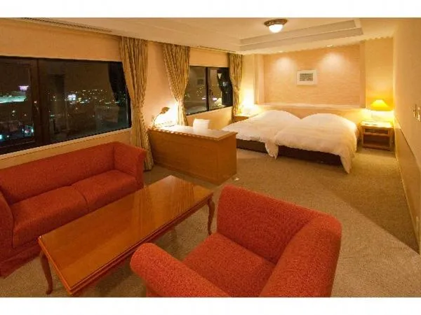 Bed in Grand Plaza Nakatsu Hotel