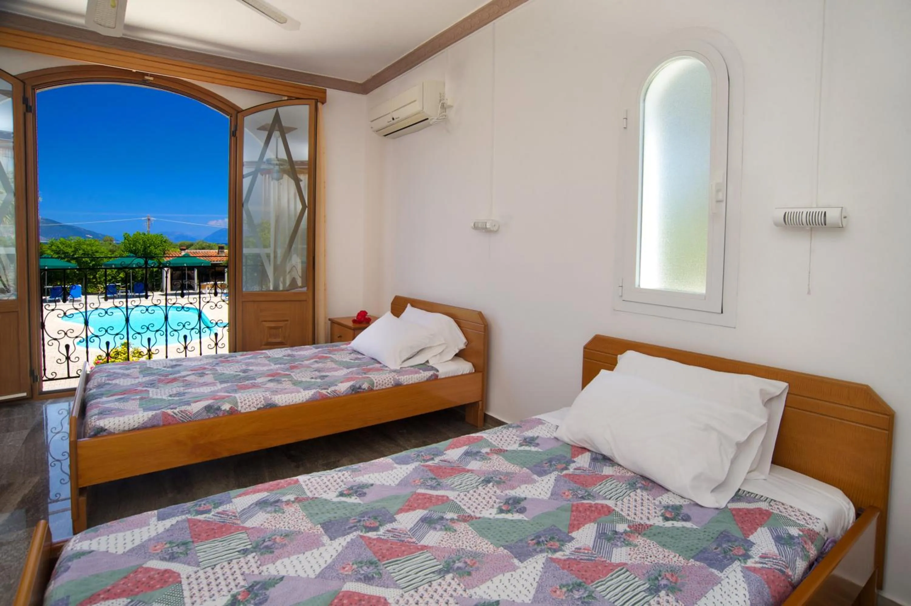 Bed in Nikos Studios and Apartments