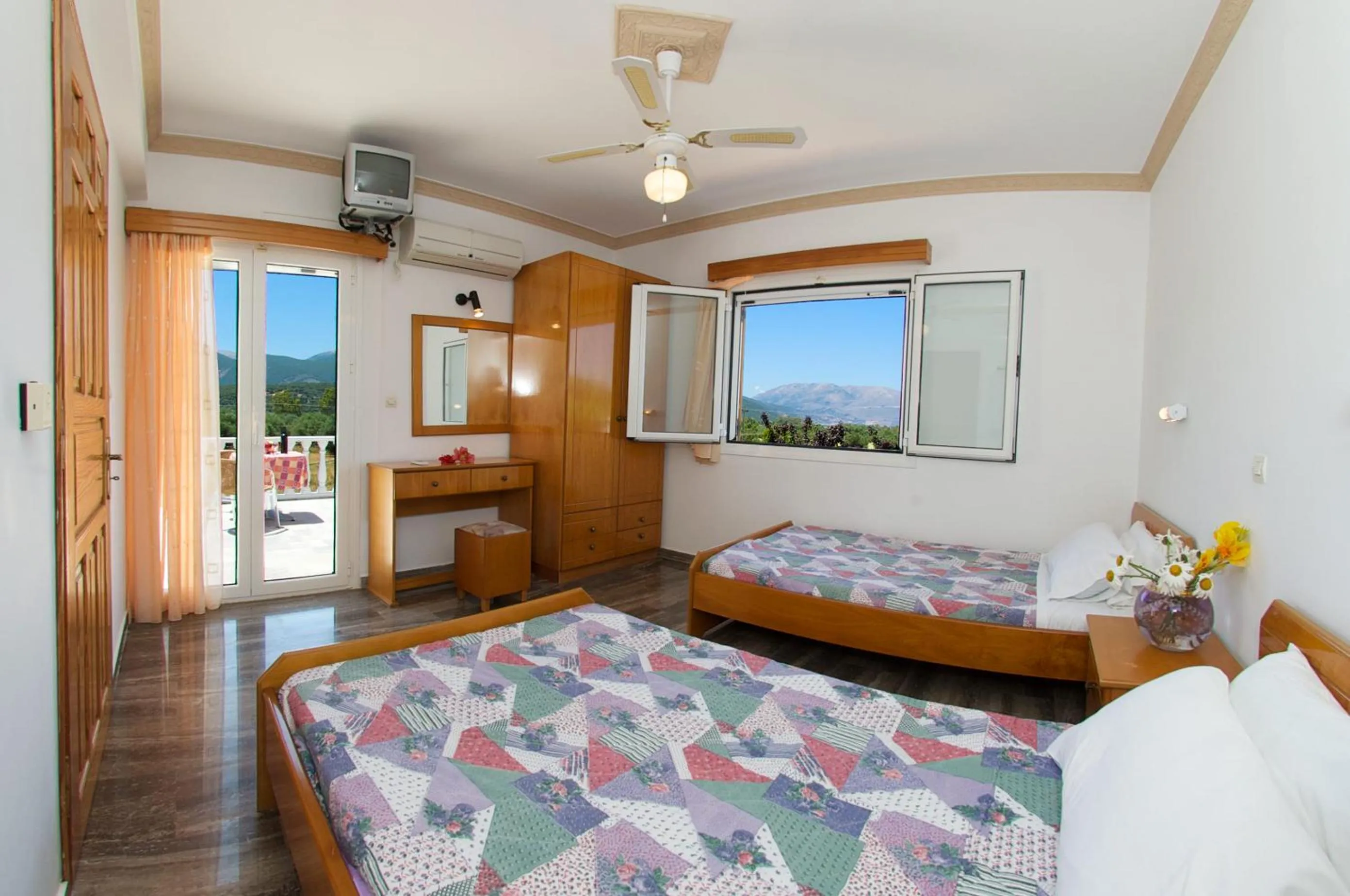 Bed in Nikos Studios and Apartments