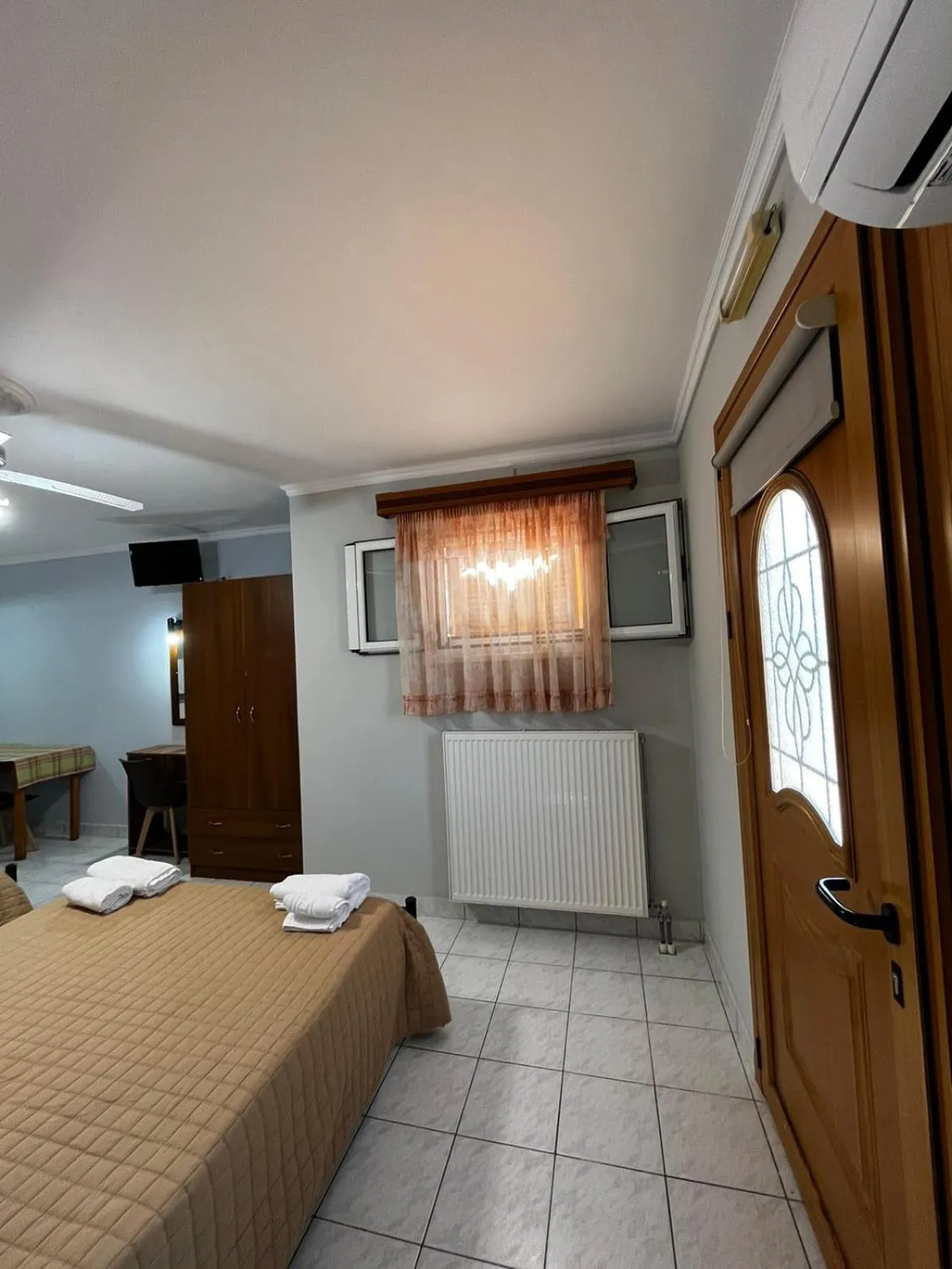 Bed in Nikos Studios and Apartments