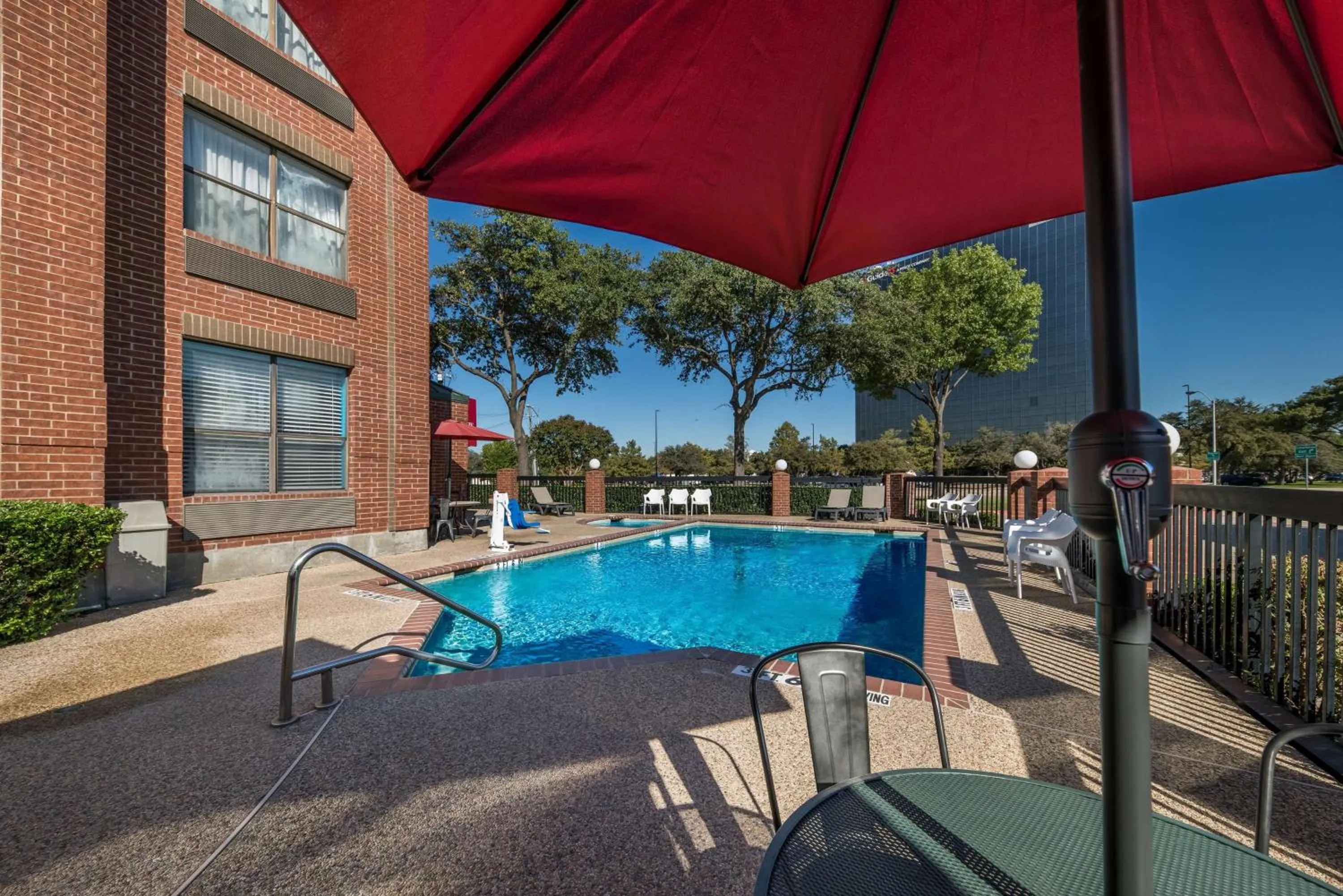 Pool view in SureStay Plus Hotel by Best Western Plano