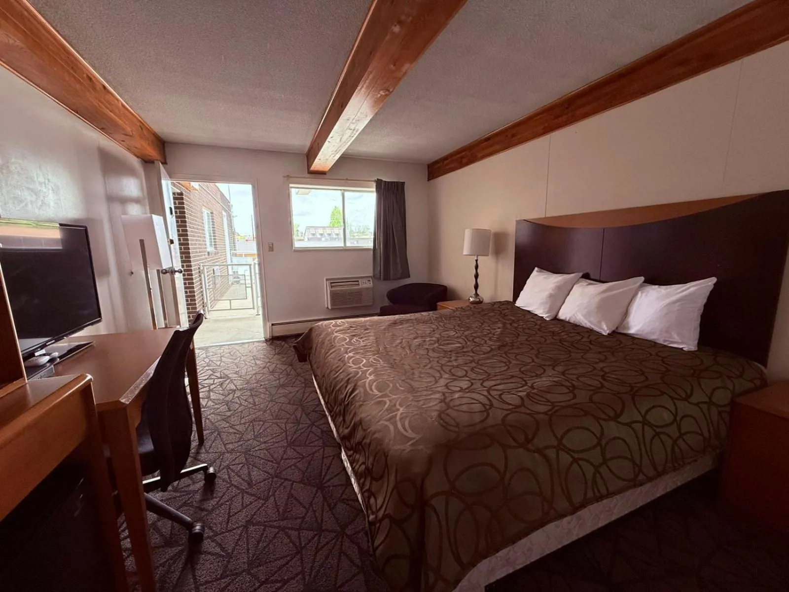 Bedroom, Bed in Tomahawk Motor Lodge By OYO Riverton US-26