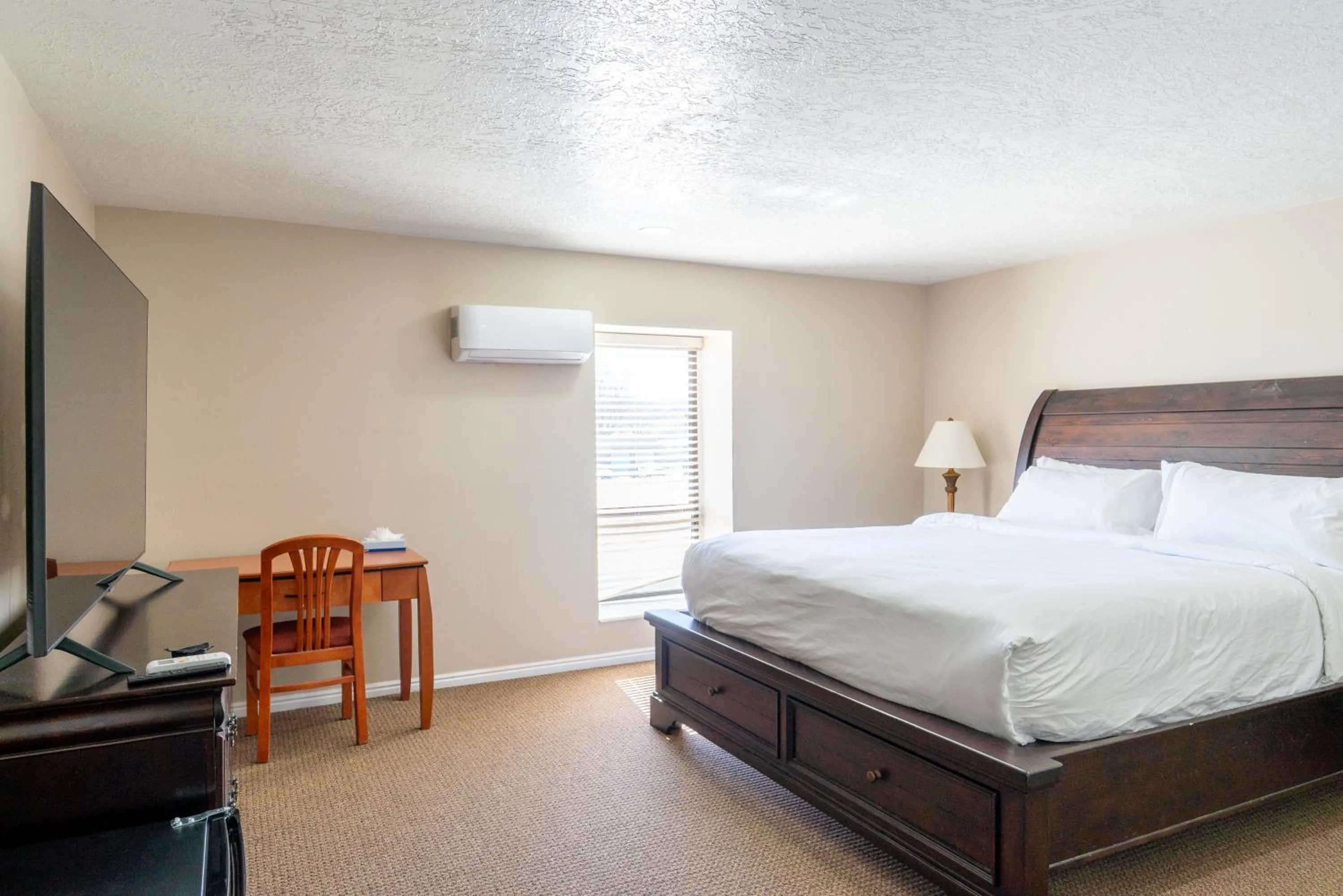 Bed in Road Creek Inn