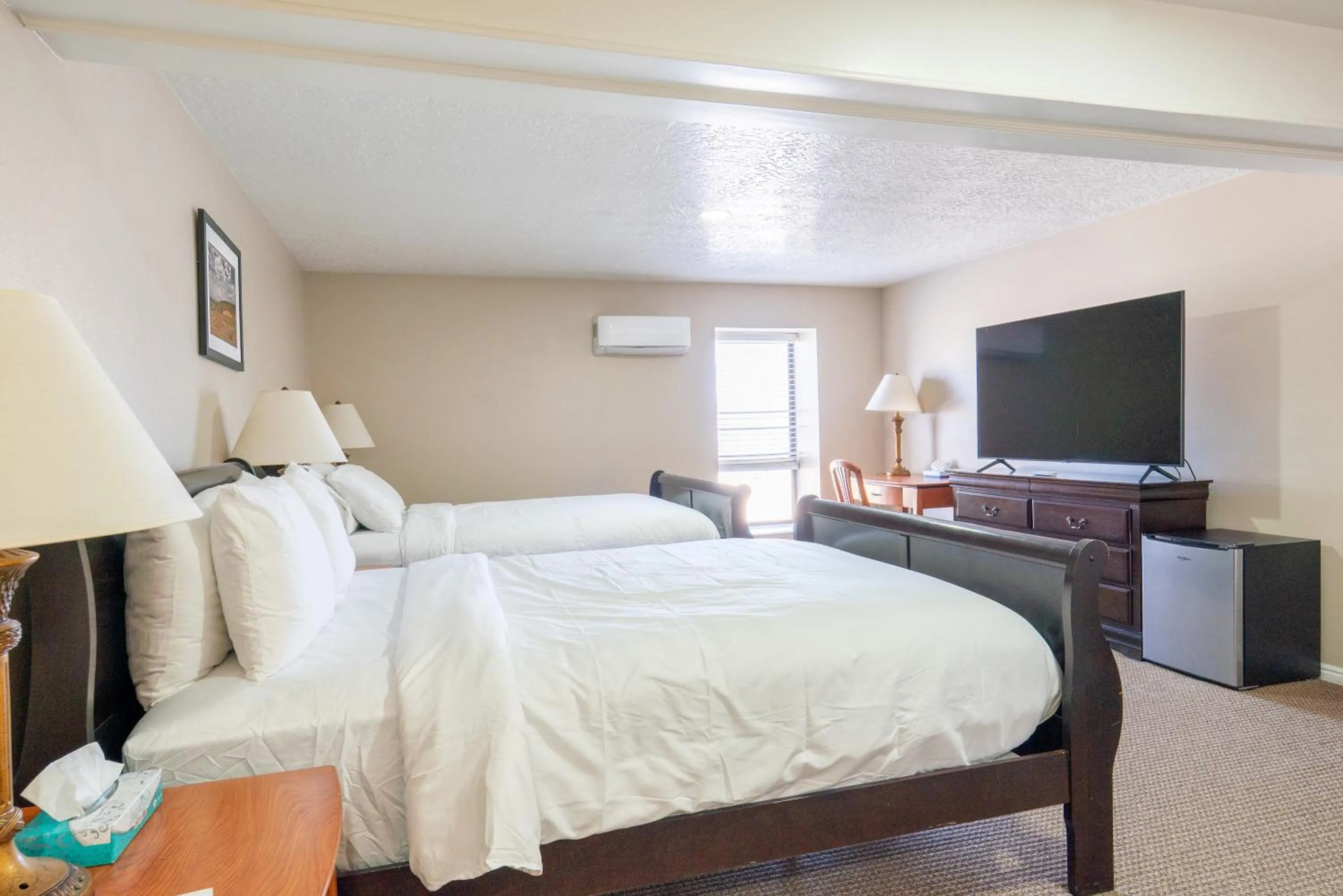 Bed in Road Creek Inn