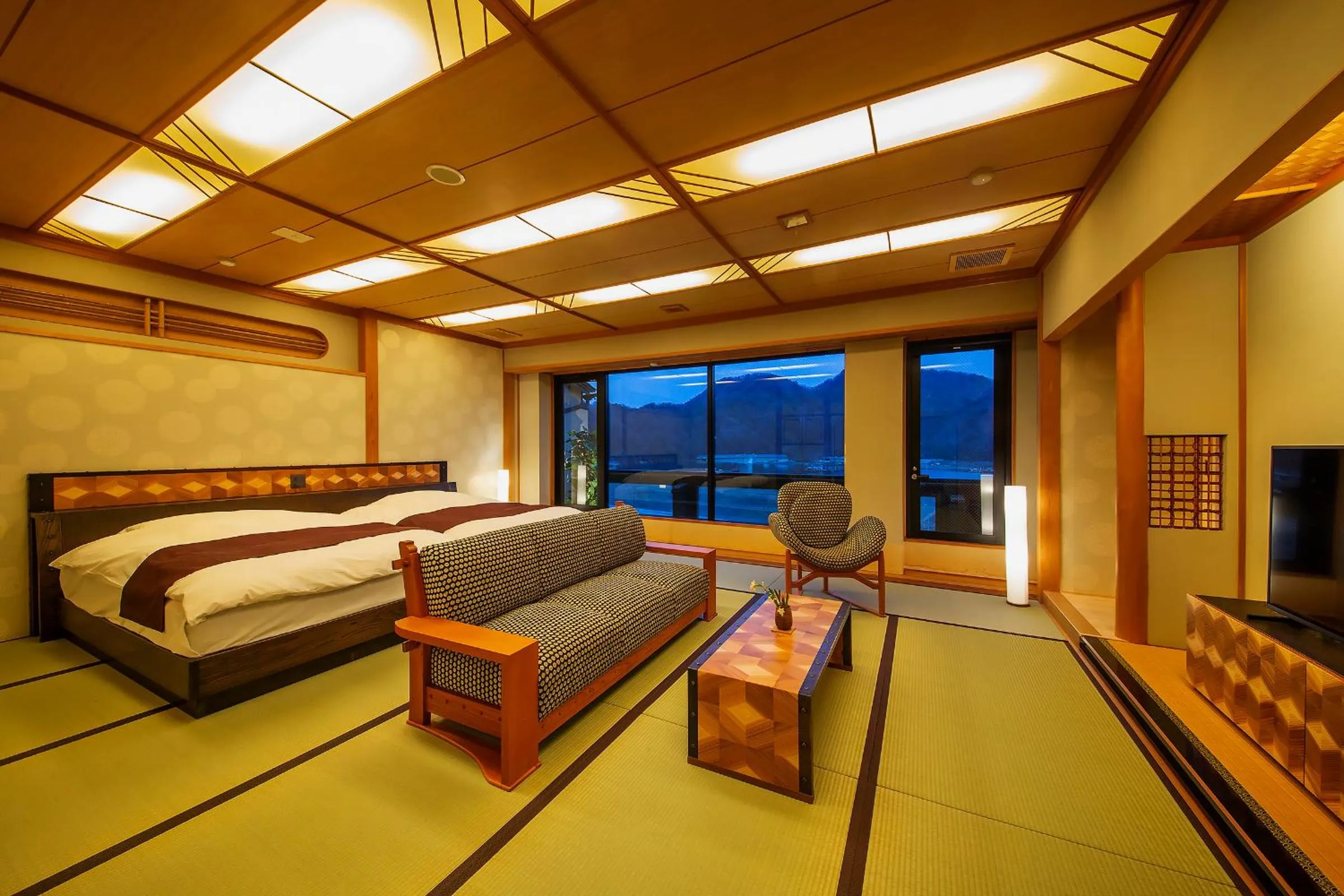 Bed in Kawaguchiya Kinosaki Riverside Hotel