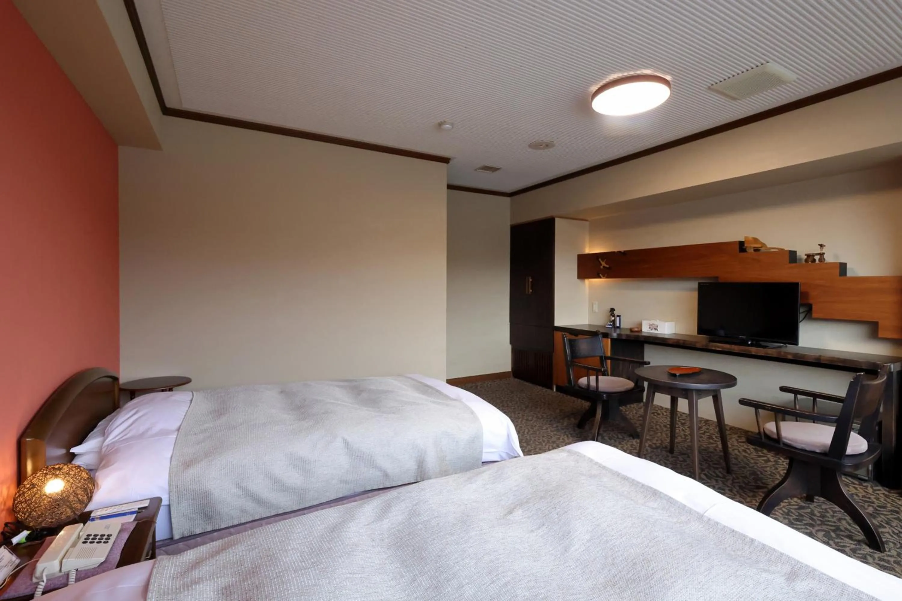 Bed in Kawaguchiya Kinosaki Riverside Hotel