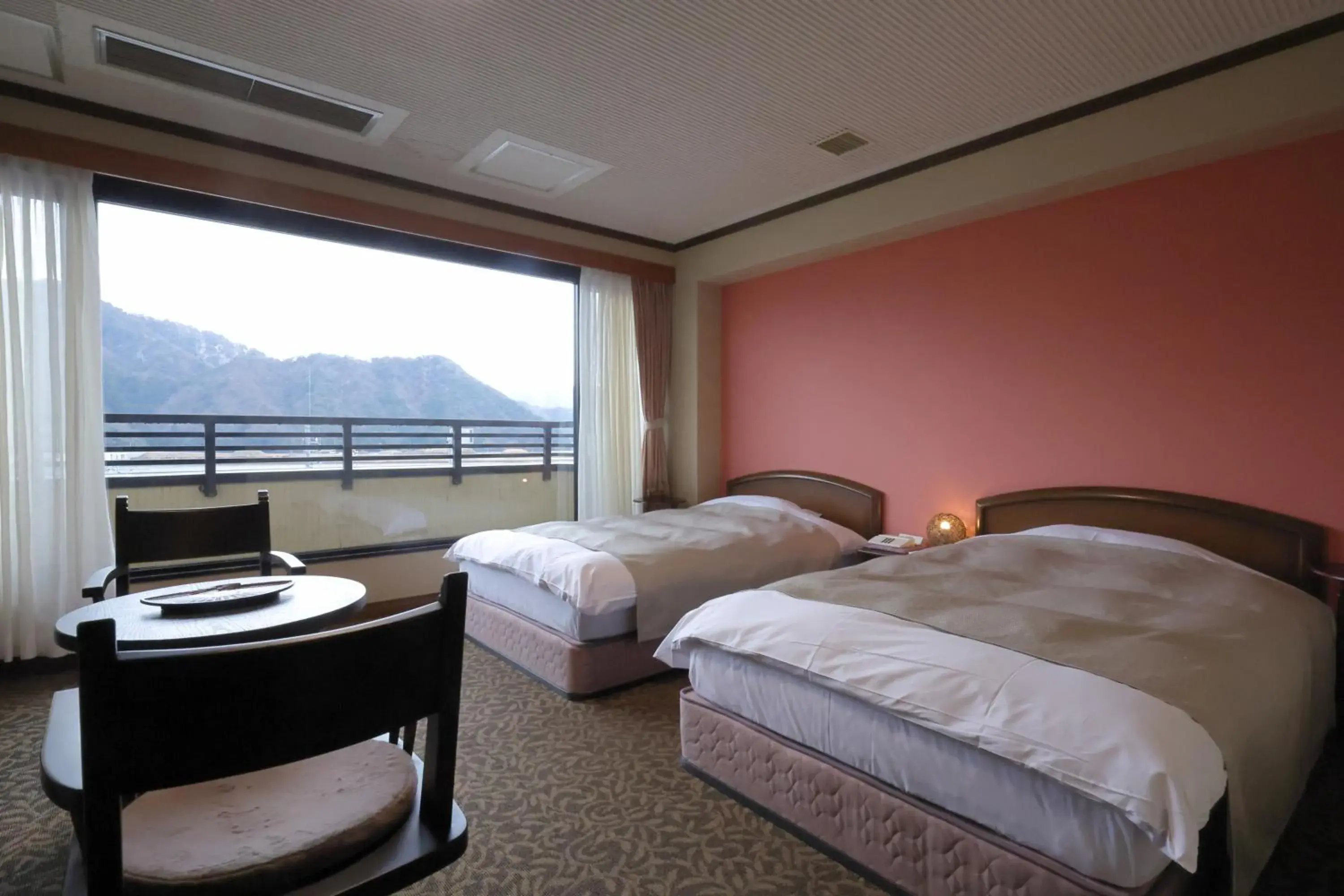 View (from property/room), Bed in Kawaguchiya Kinosaki Riverside Hotel View (from property/room), Bed in Kawaguchiya Kinosaki Riverside Hotel