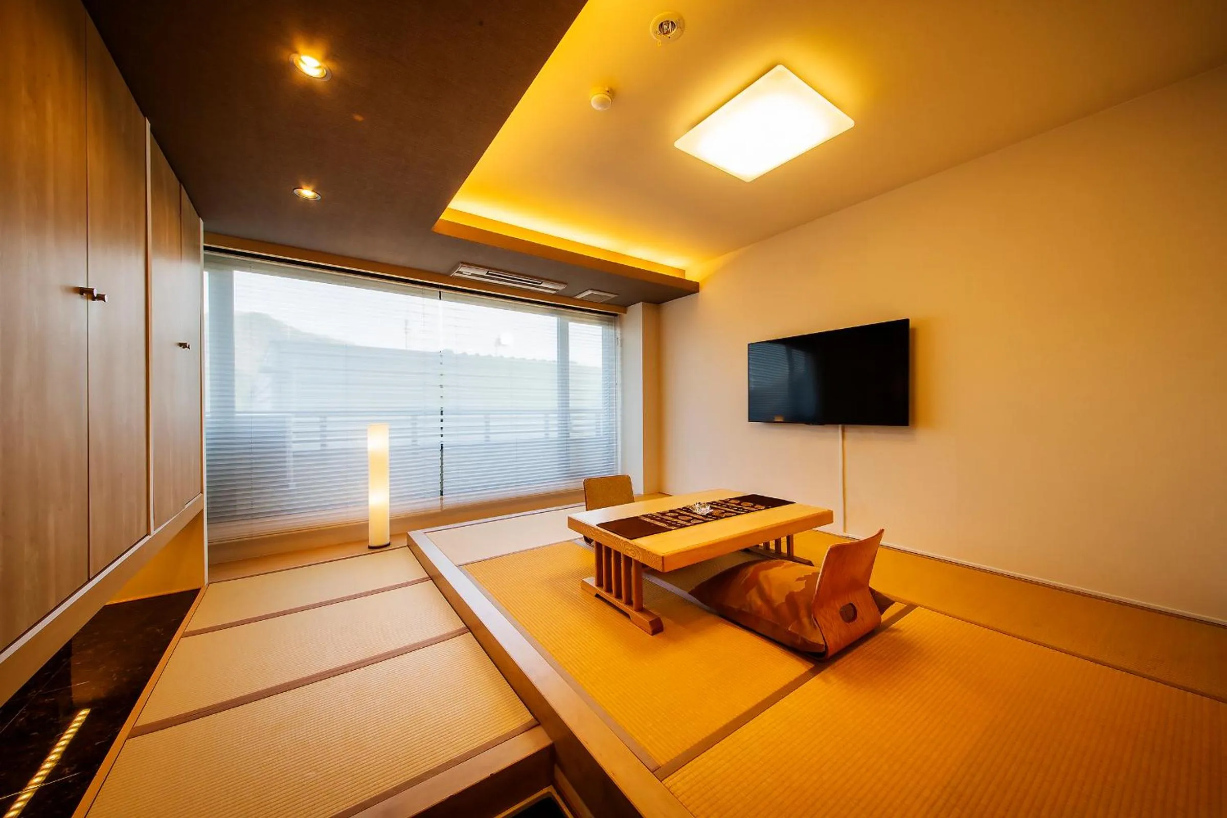Living room, Bed in Kawaguchiya Kinosaki Riverside Hotel