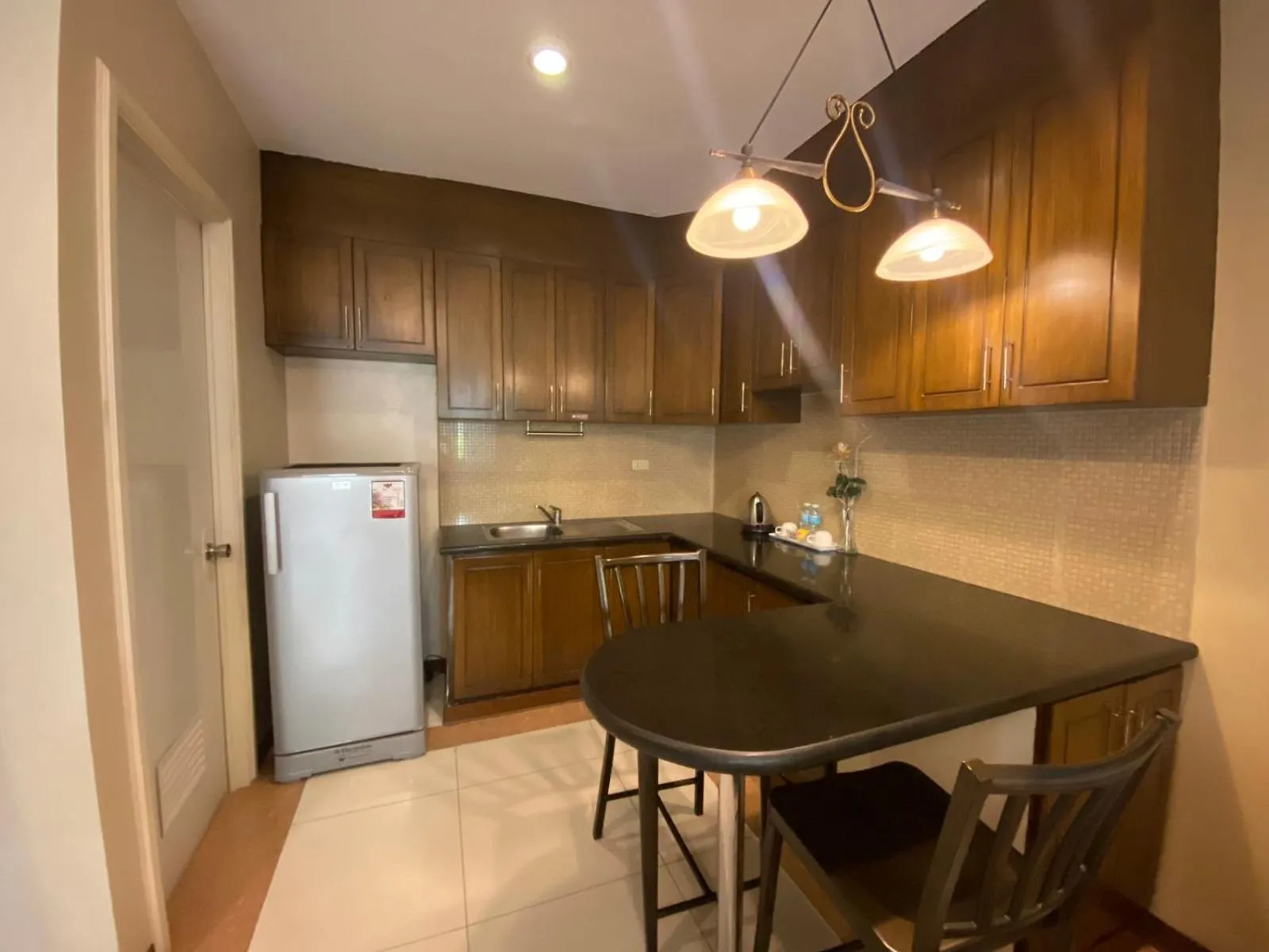 Kitchen or kitchenette in Prism Hotel