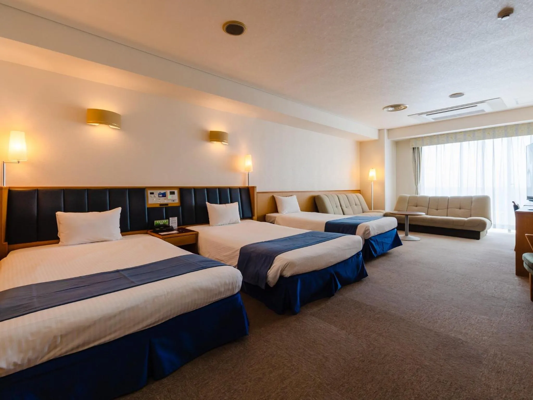 Photo of the whole room, Bed in Hotel Resonex Nago