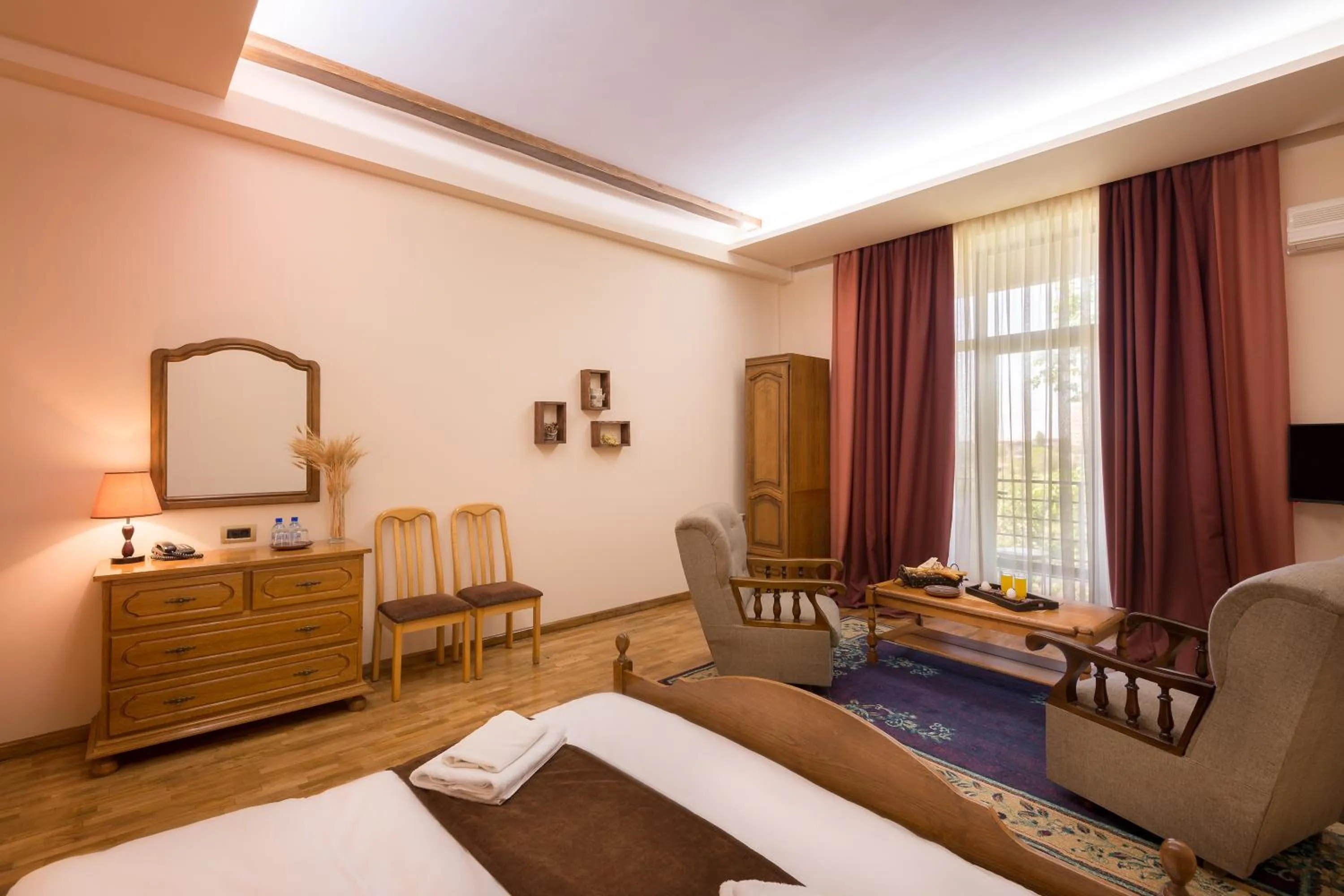 Seating area, Bed in Olympia Garden Hotel