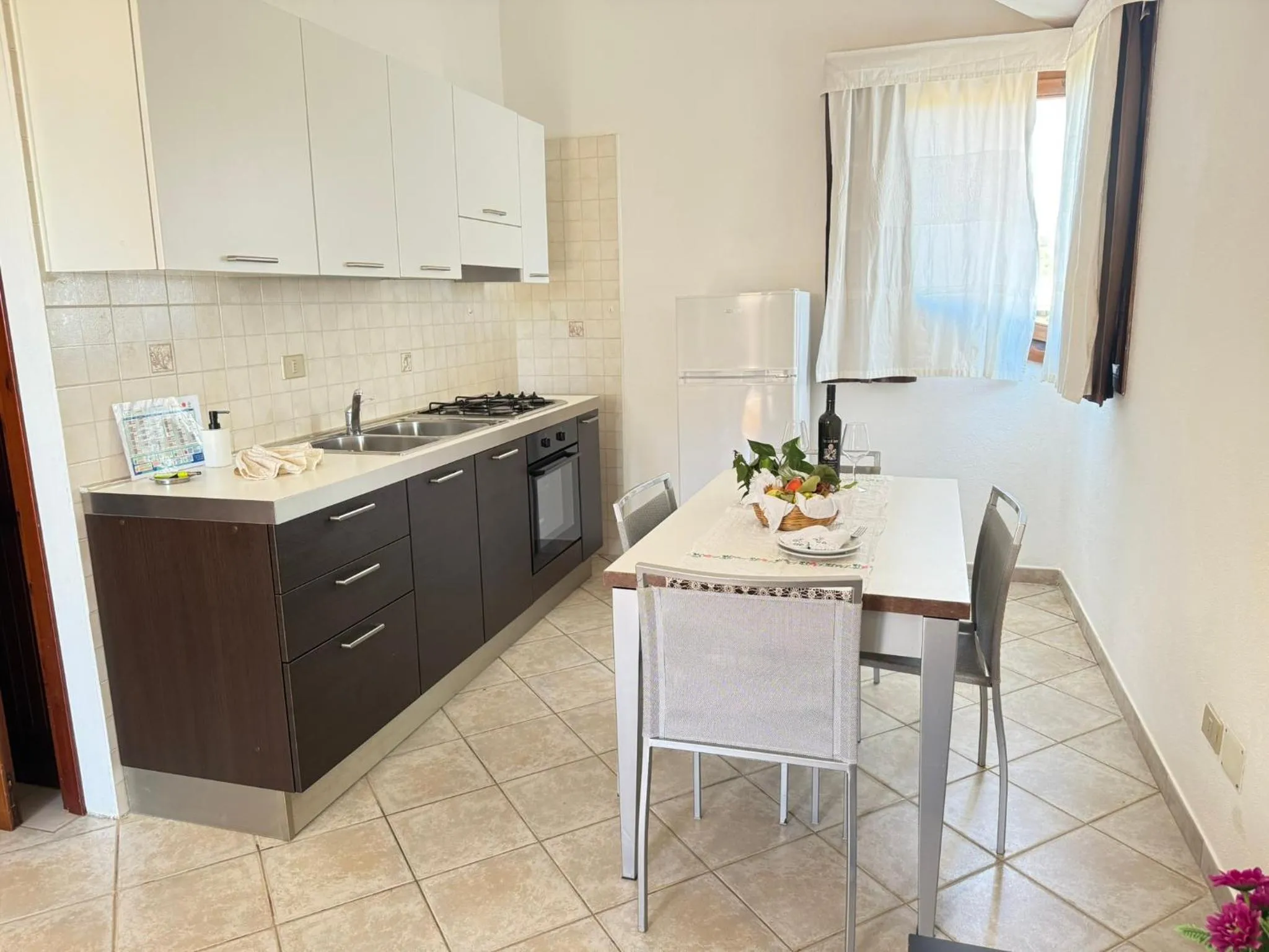 Kitchen or kitchenette in Residence Il Borgo di Porto Corallo