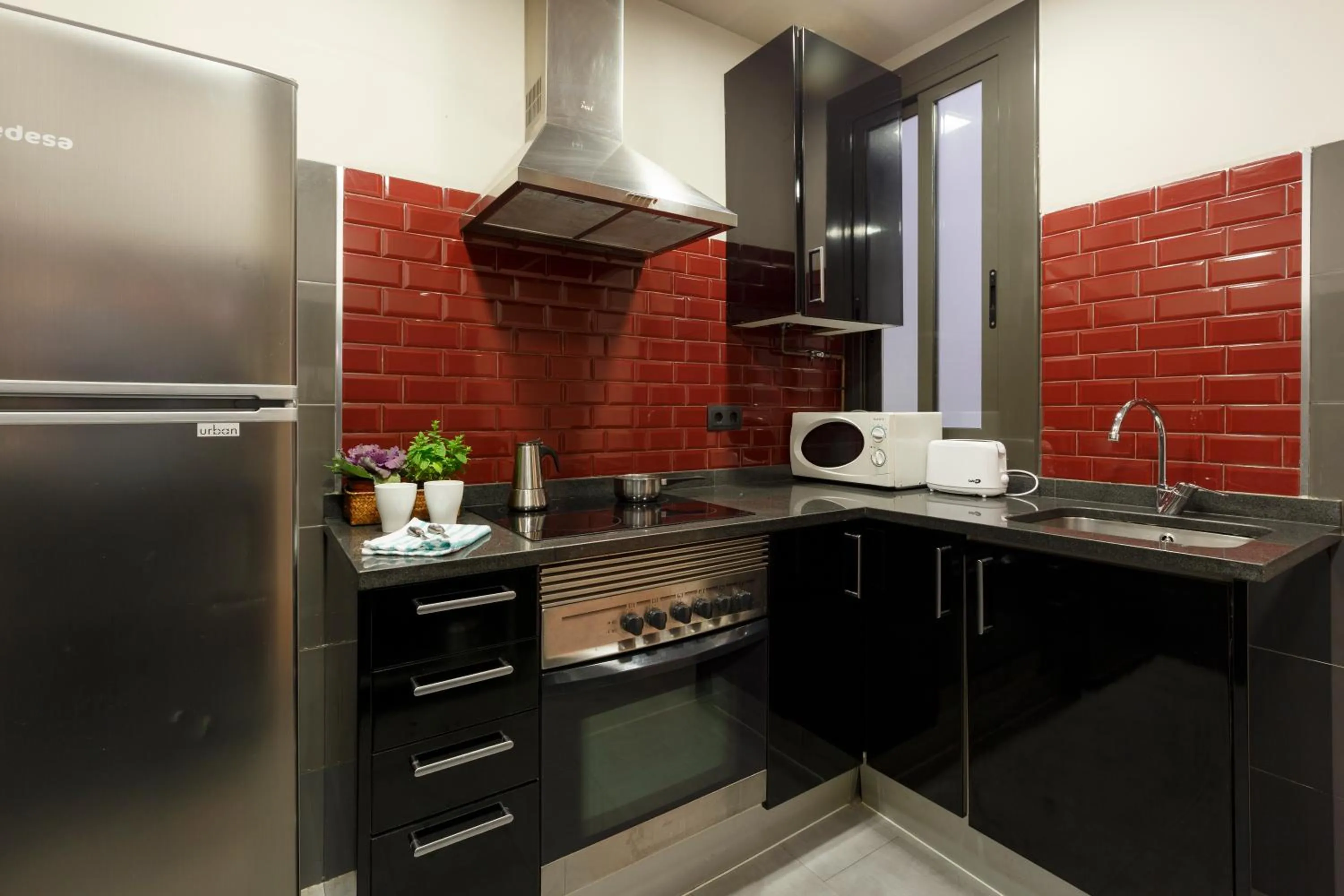 Kitchen or kitchenette in AinB Eixample-Miro Apartments