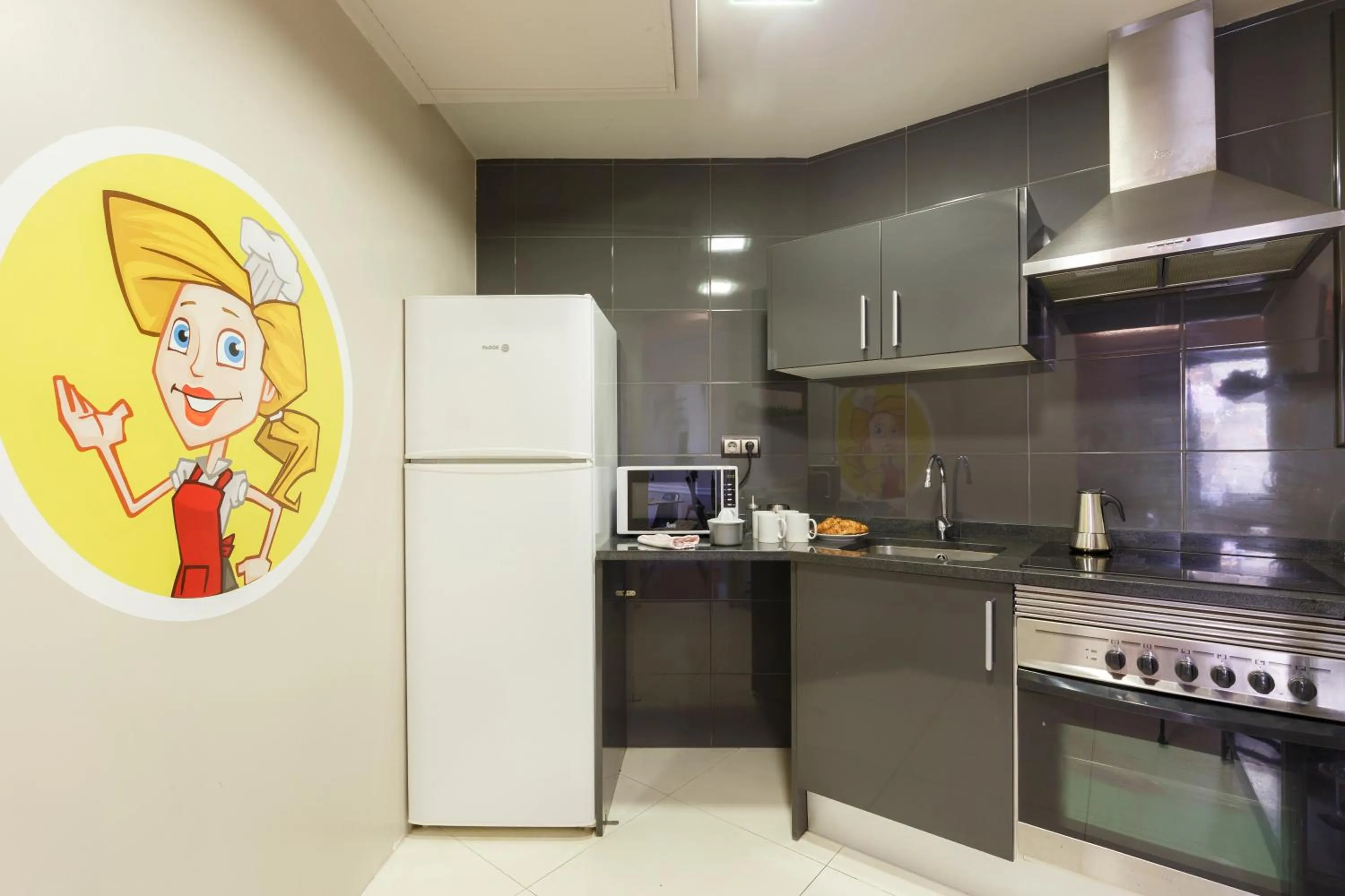 Kitchen or kitchenette in AinB Eixample-Miro Apartments
