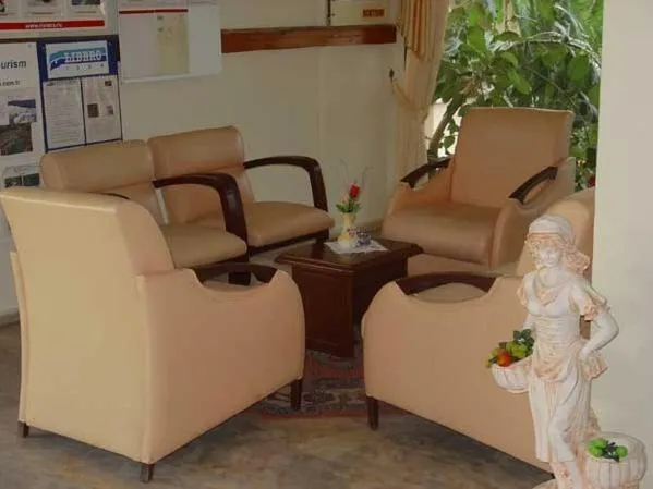 Communal lounge/ TV room in Amos Hotel