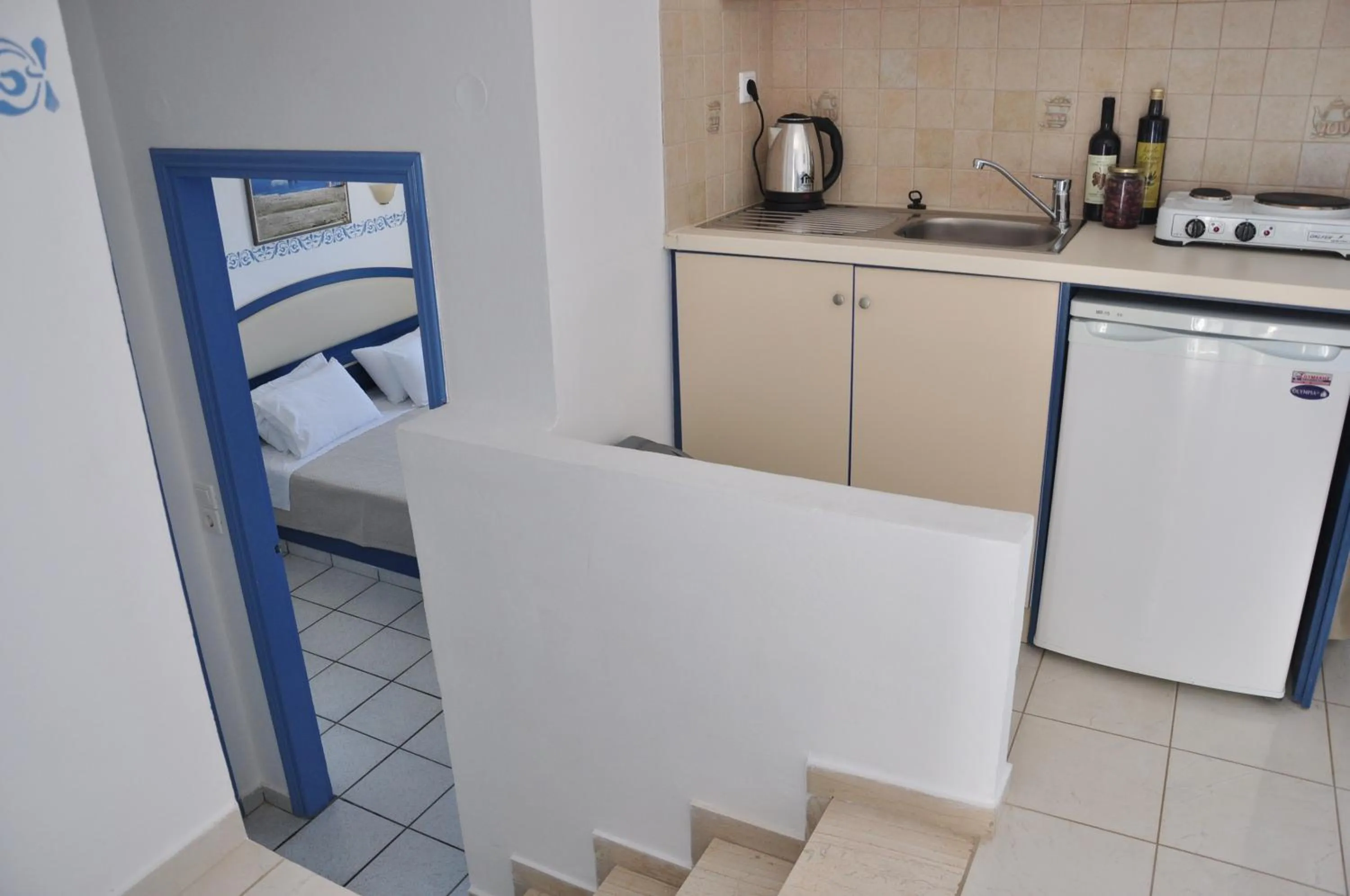 Kitchen or kitchenette, Bed in Castri Village Hotel