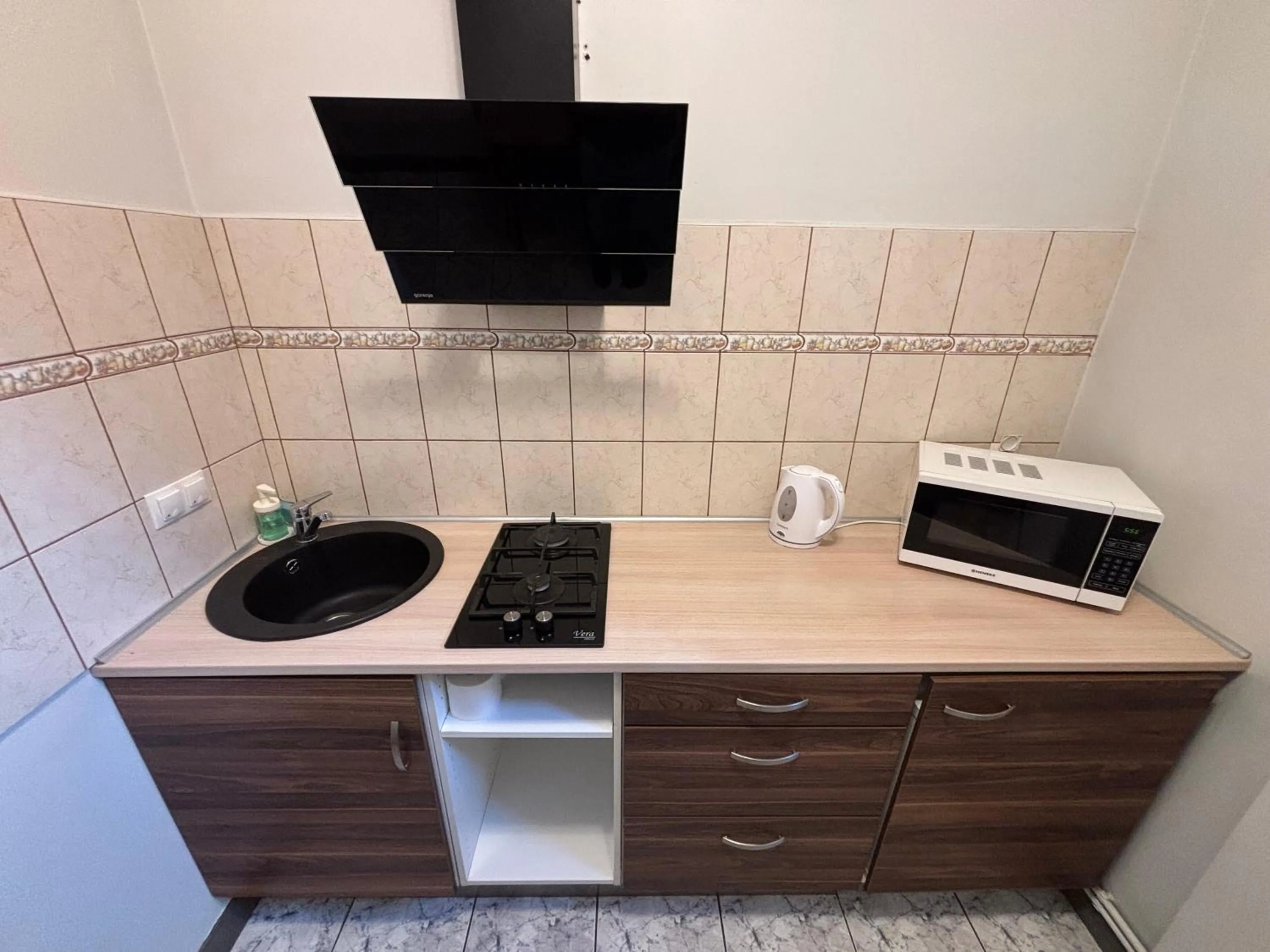 Kitchen or kitchenette in ApartHotel Riga