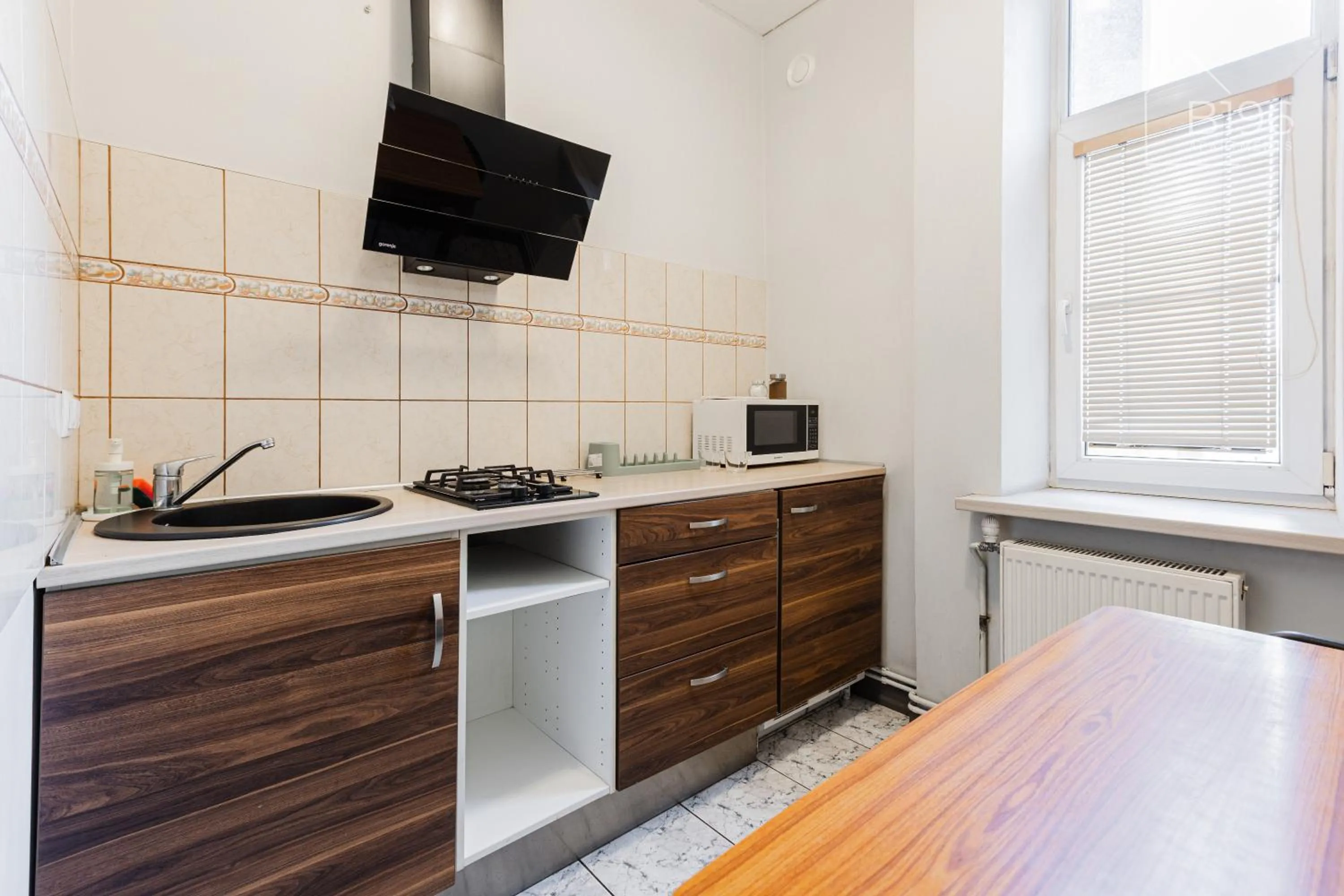 Kitchen or kitchenette in ApartHotel Riga