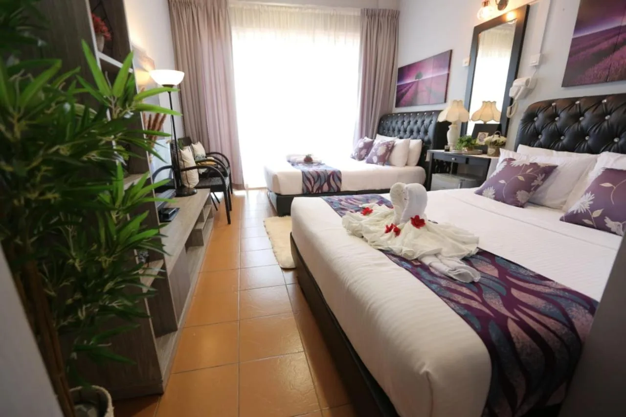 Bed in Ghazrin's Garuda Hotel