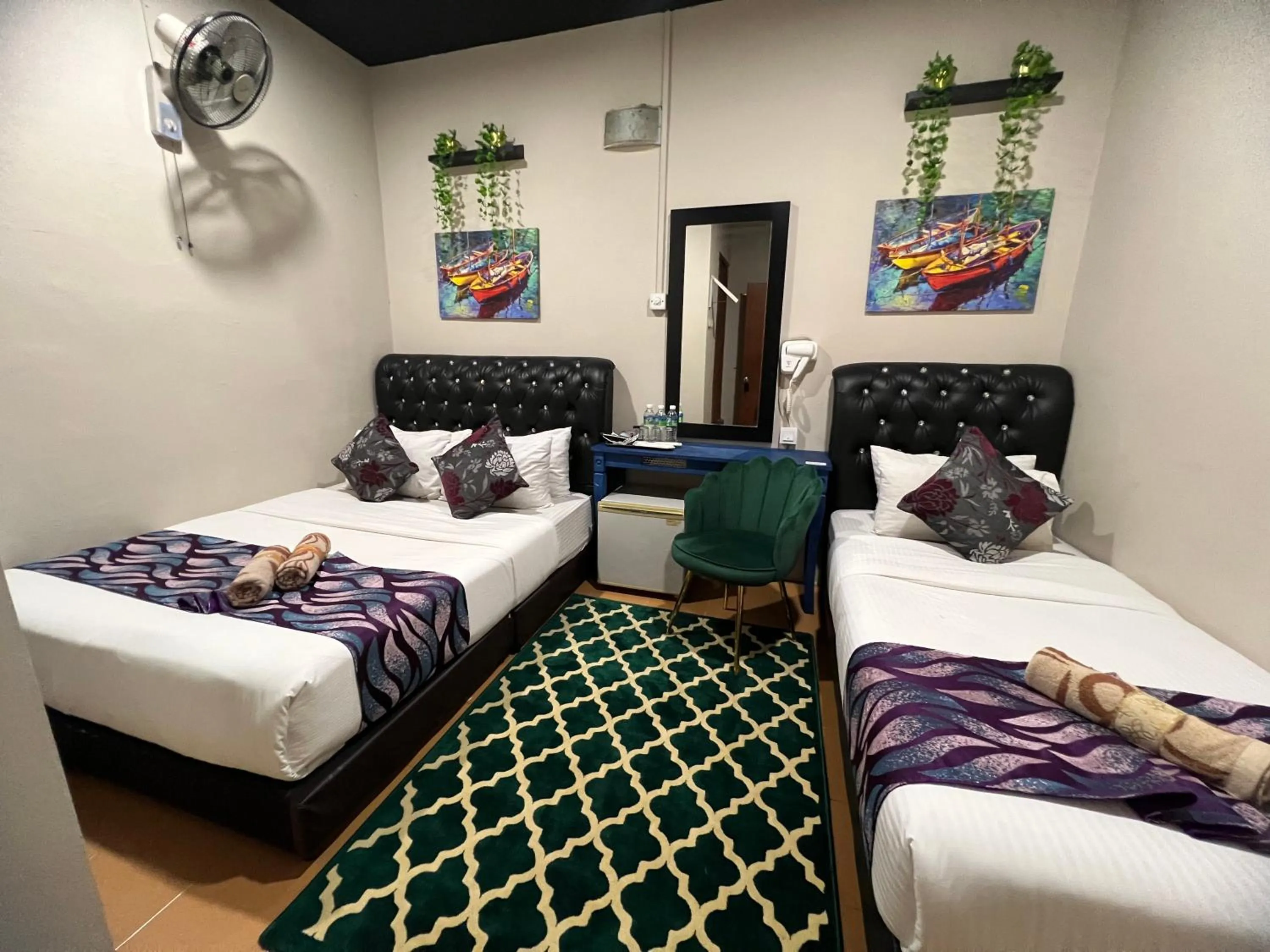 Bed in Ghazrin's Garuda Hotel