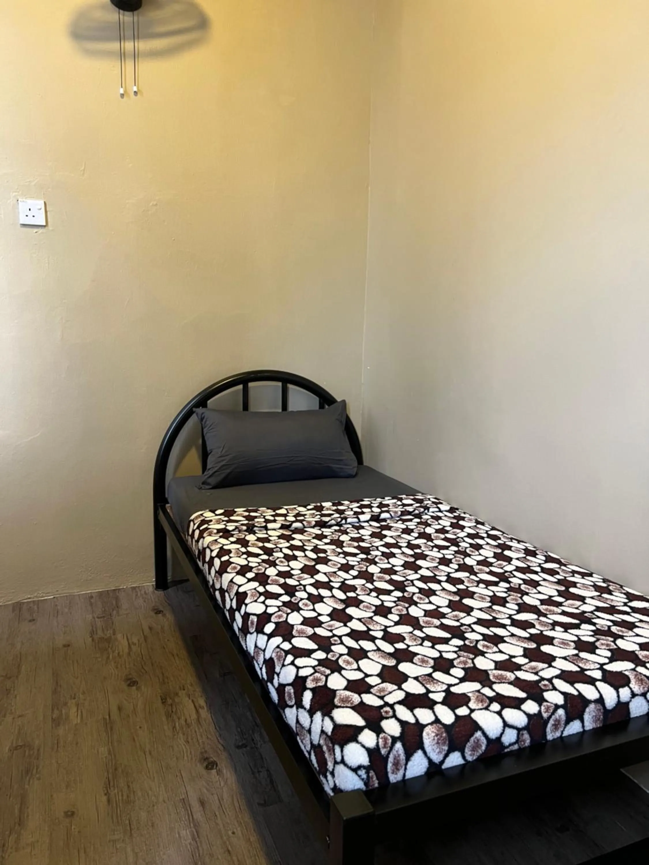 Bed in Ghazrin's Garuda Hotel