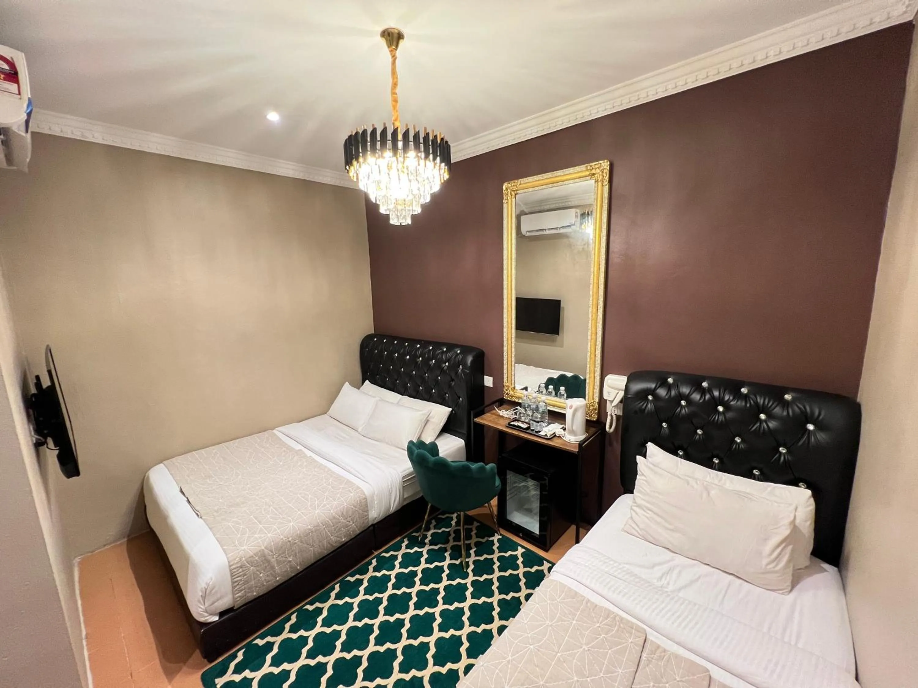 Bed in Ghazrin's Garuda Hotel