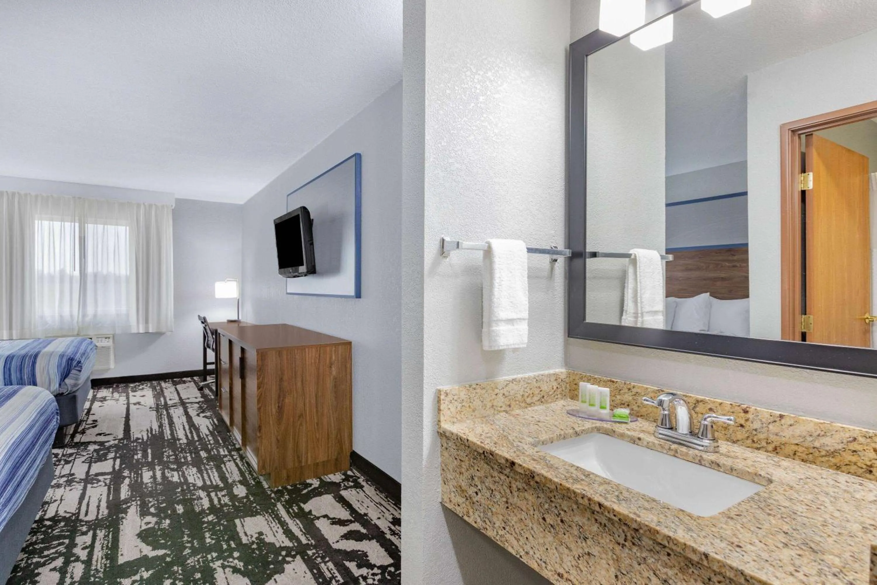 Bathroom in AmericInn by Wyndham Pella