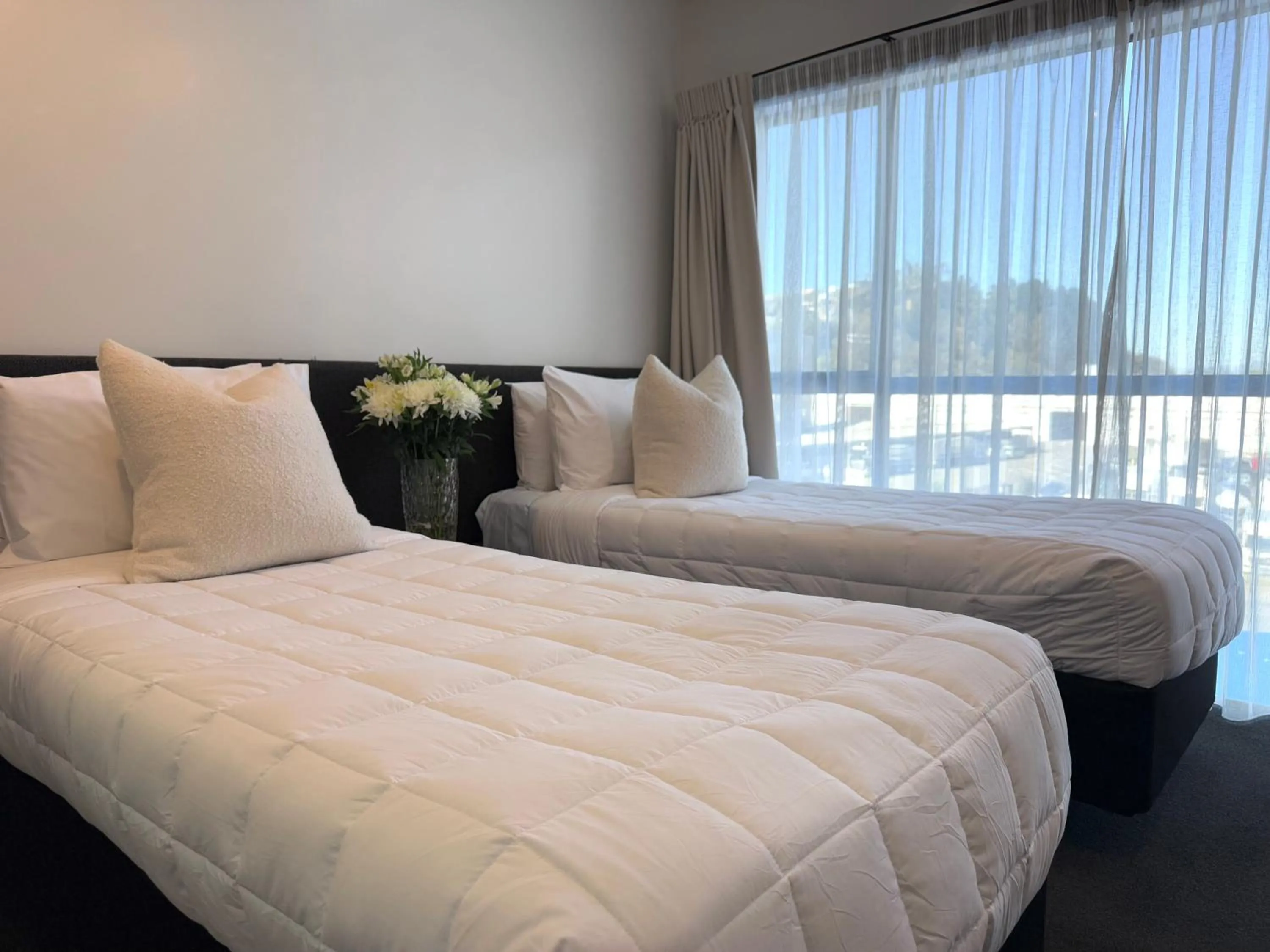 Bed in Bluewater Hotel