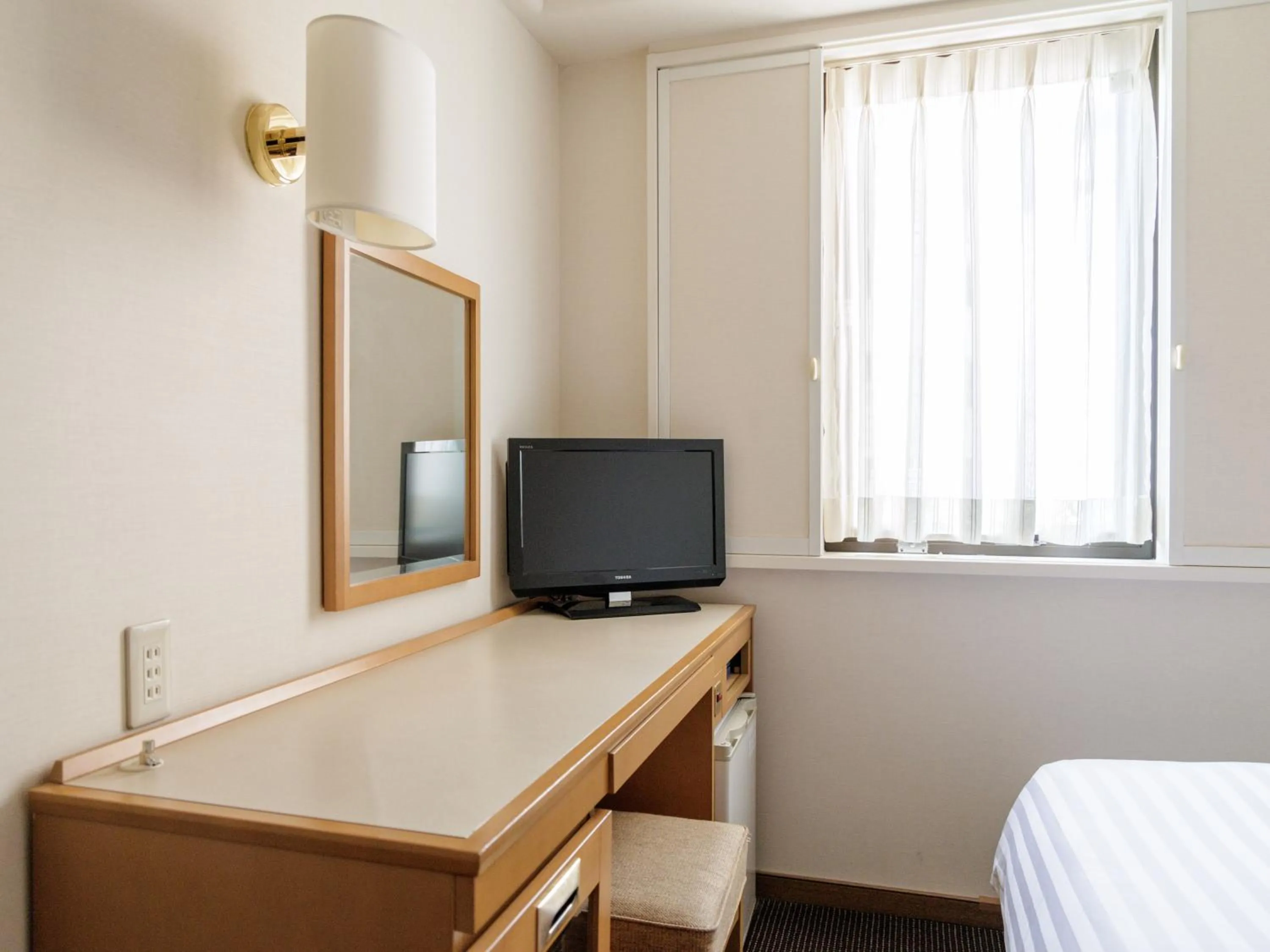 Photo of the whole room, Bed in Nishitetsu Inn Tenjin