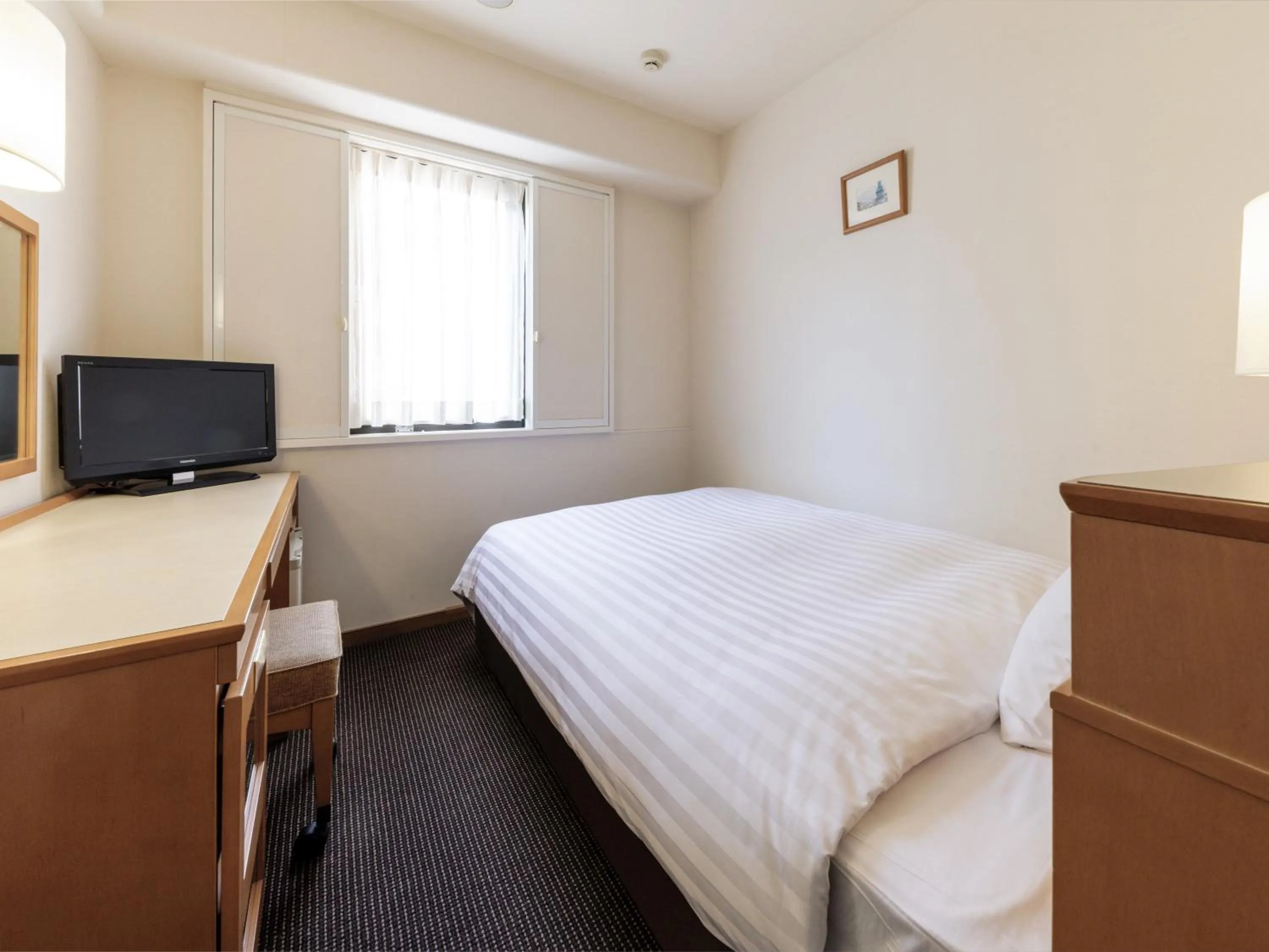 Photo of the whole room, Bed in Nishitetsu Inn Tenjin