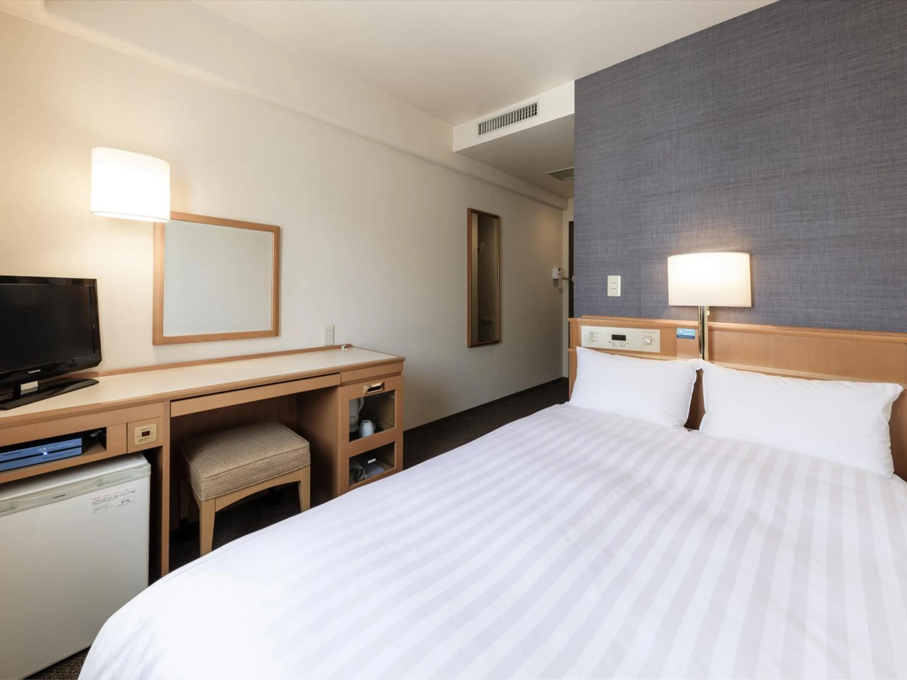 Photo of the whole room, Bed in Nishitetsu Inn Tenjin