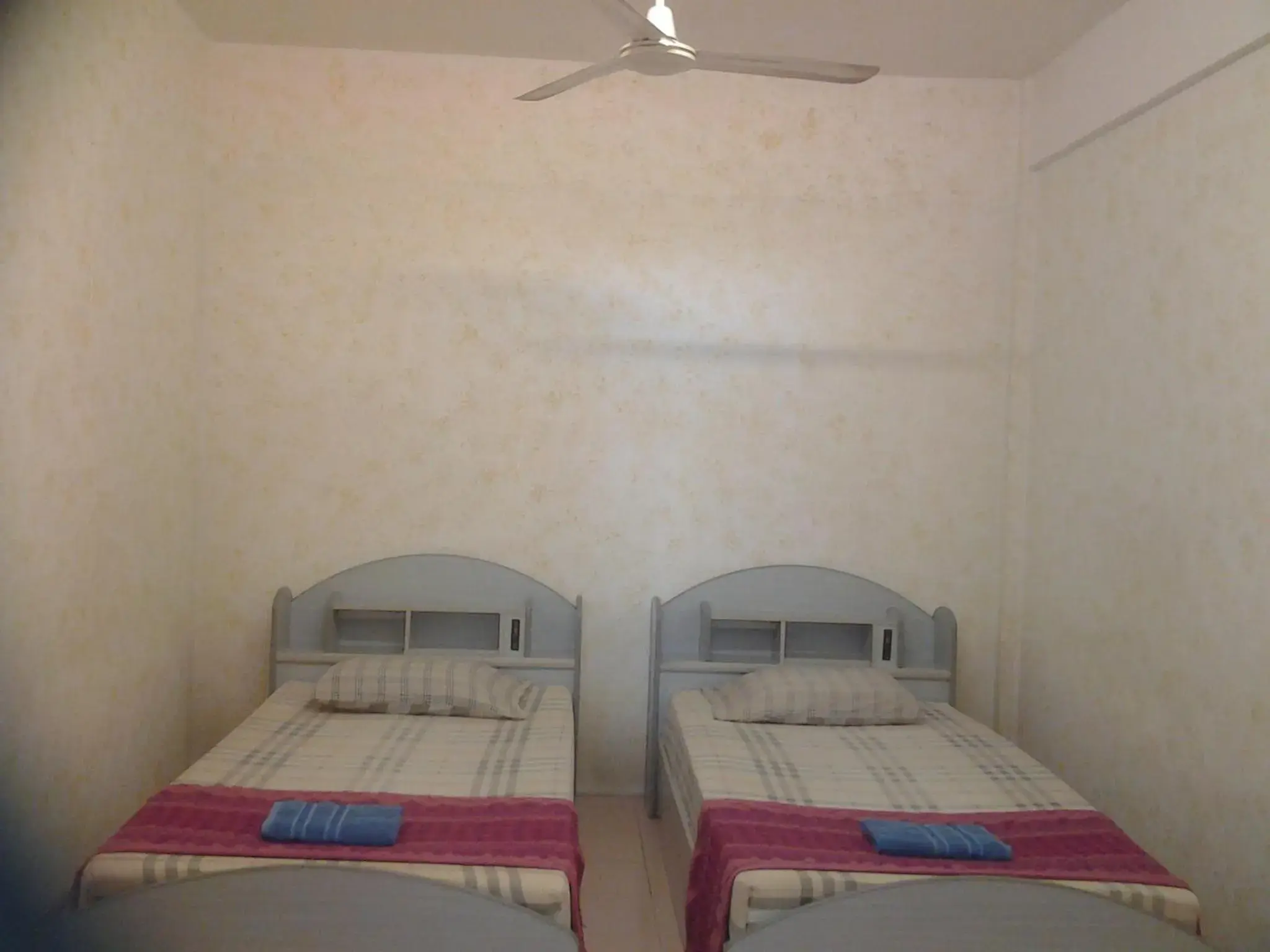 Twin Room with Fan and Shared Bathroom in JP hometel Twin Room with Fan and Shared Bathroom in JP hometel