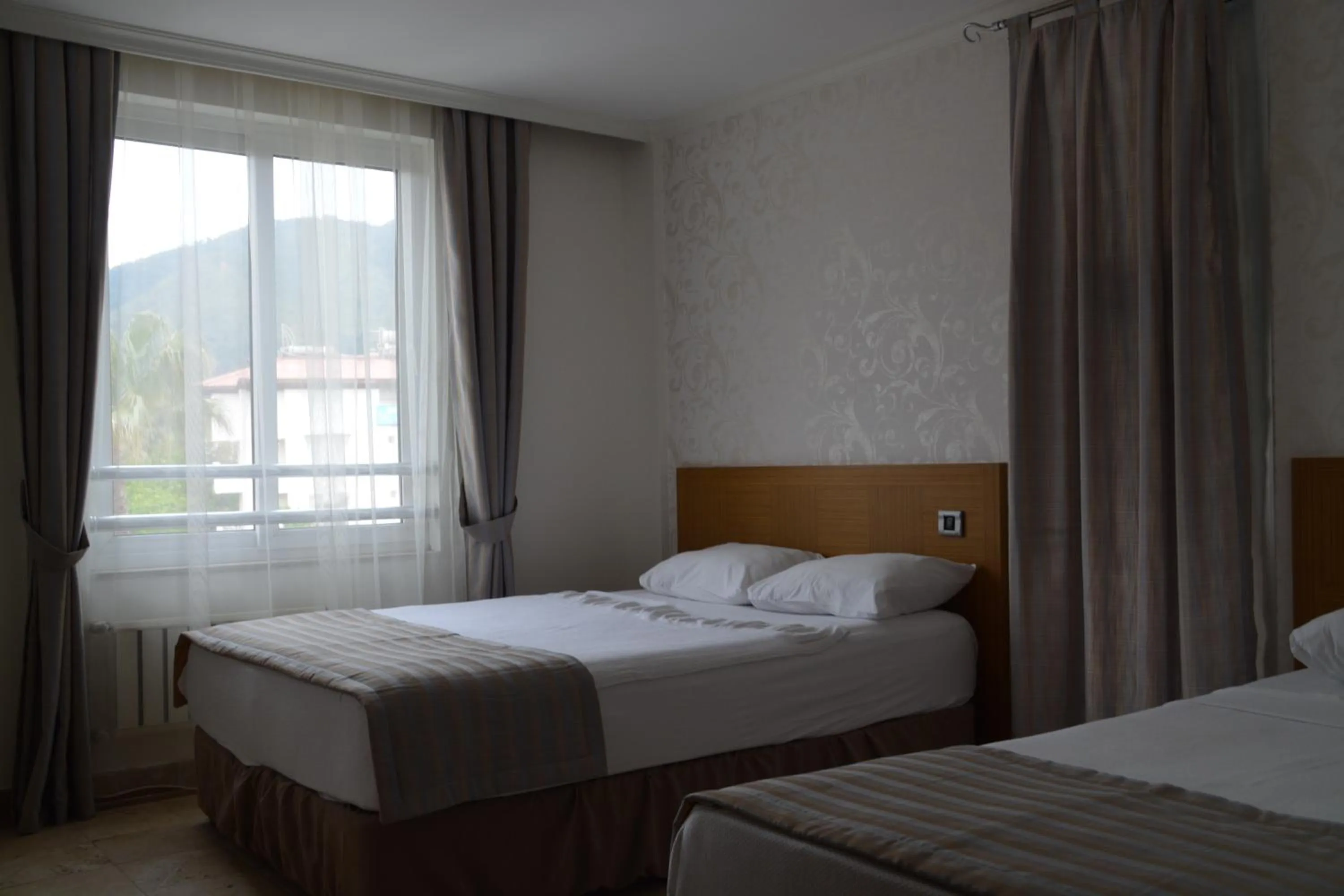 Bed in Devamli Hotel