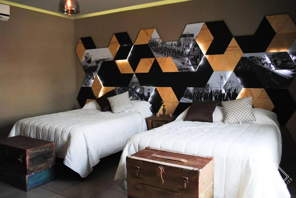 Bed in Doroteo Hotel Boutique