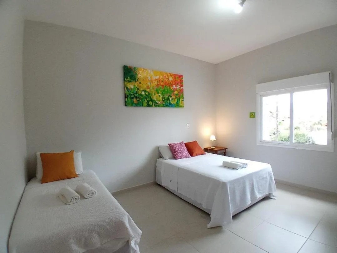 Bed in Kauano Pousada Barequeçaba