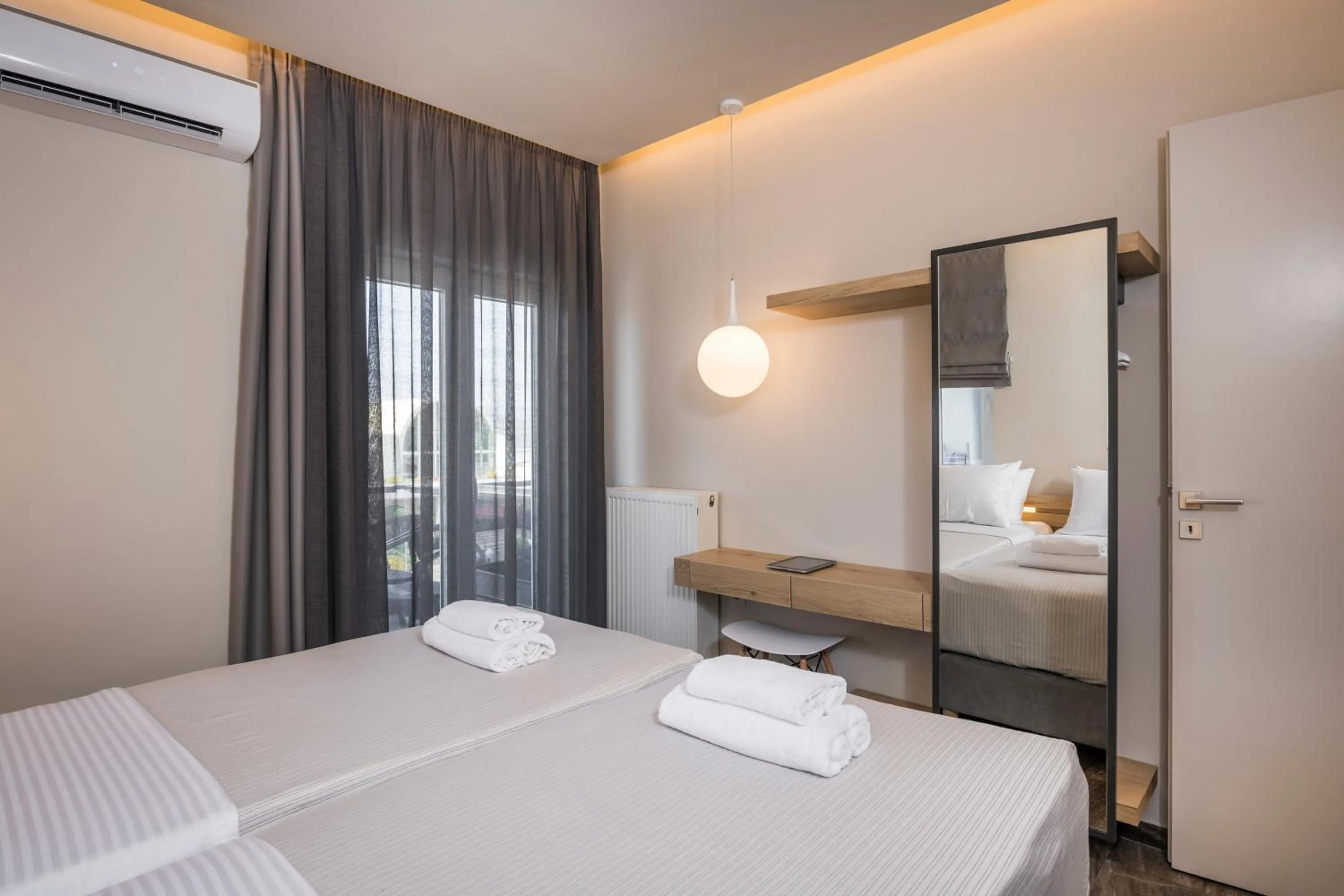 Bed in Sun Ray Luxury Apartments