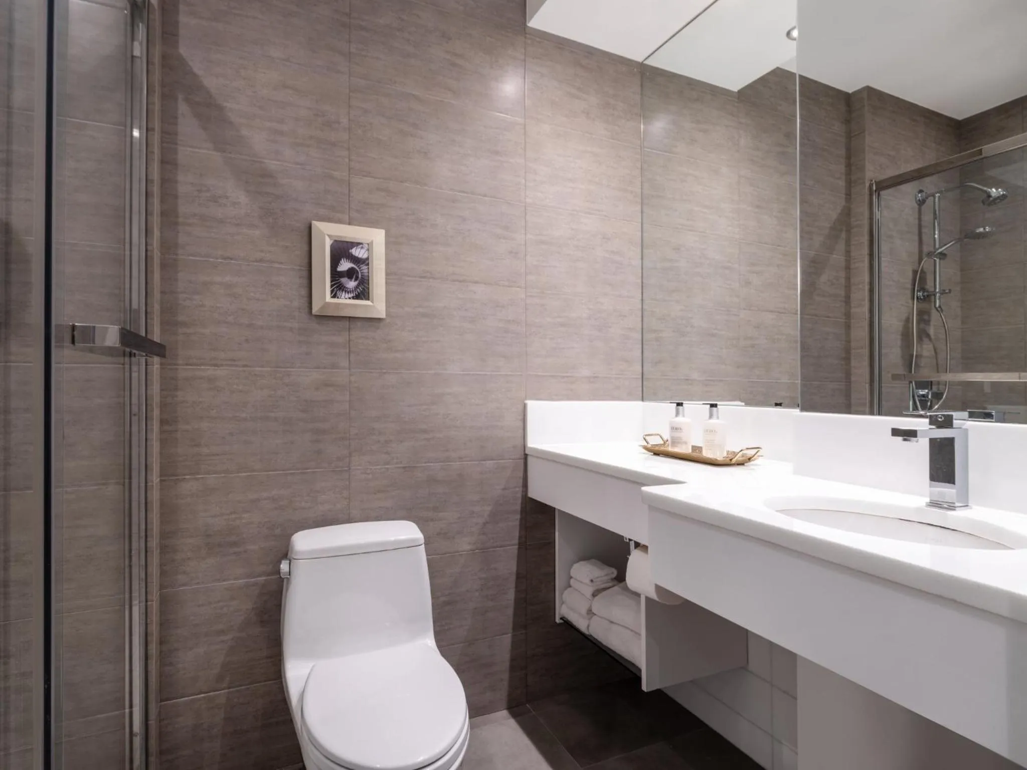 Bathroom in voco Fiorello - LaGuardia Airport by IHG