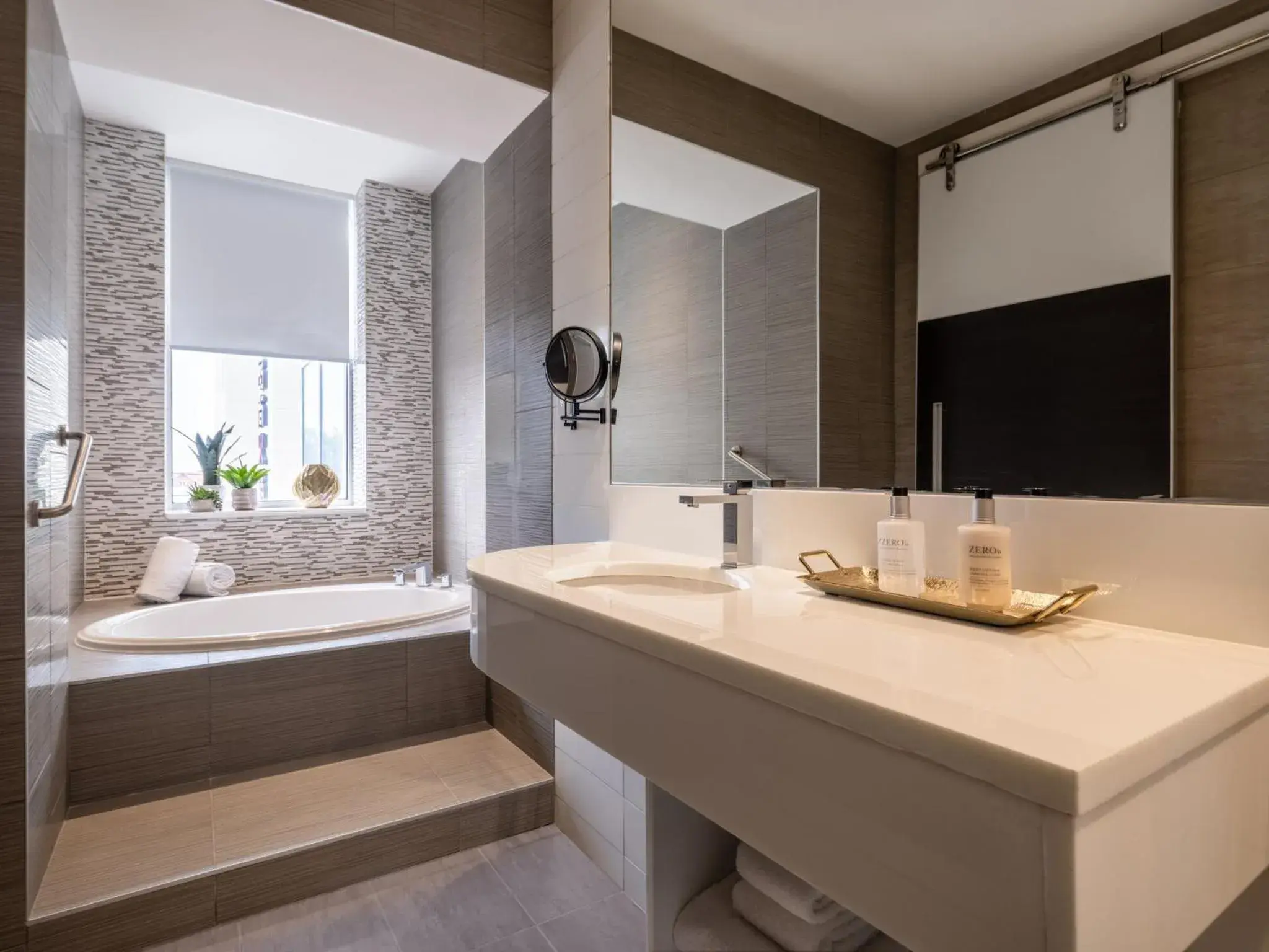 Bathroom in voco Fiorello - LaGuardia Airport by IHG Bathroom in voco Fiorello - LaGuardia Airport by IHG
