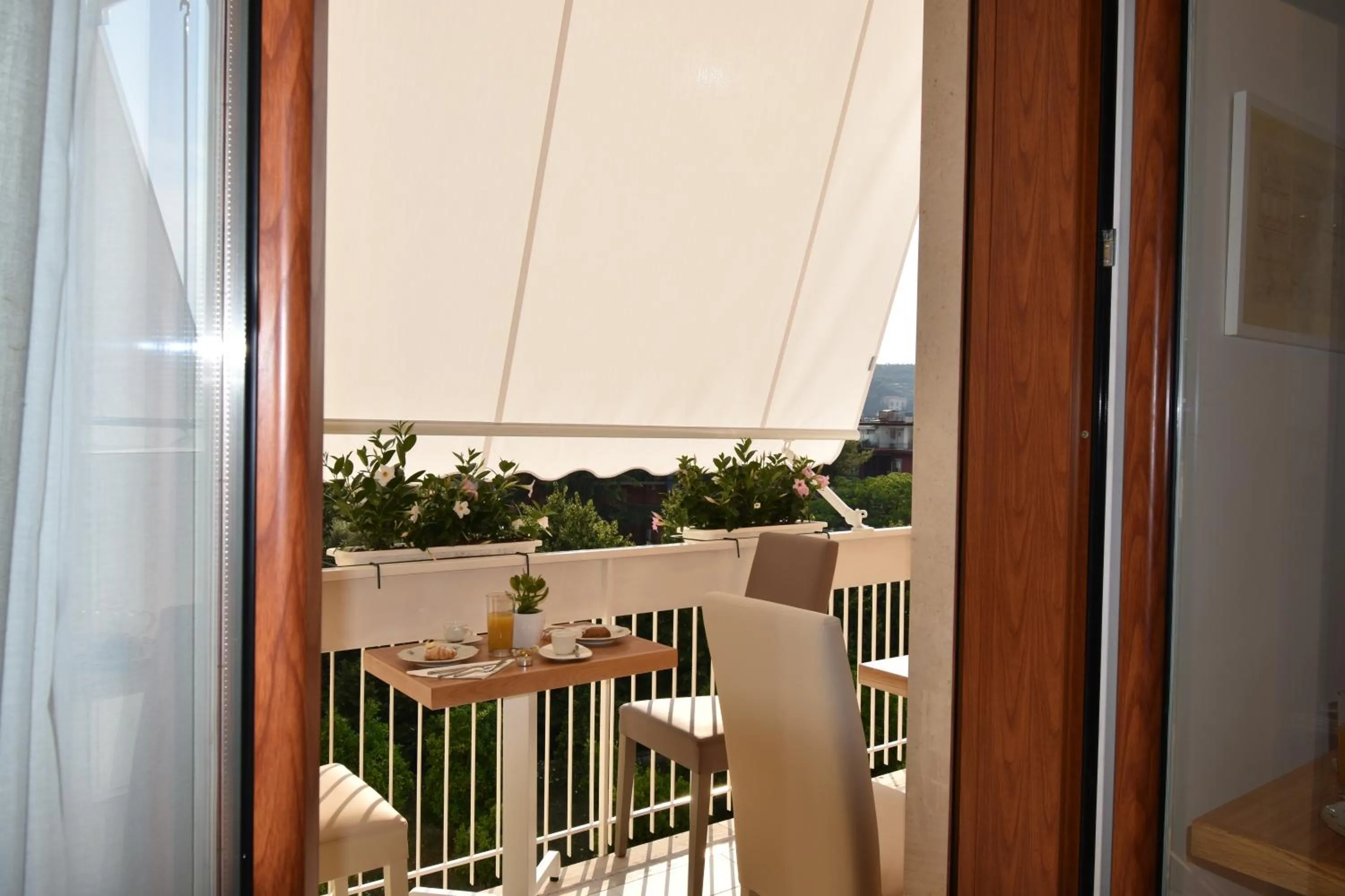 Communal lounge/ TV room in Melody Sorrento Suites