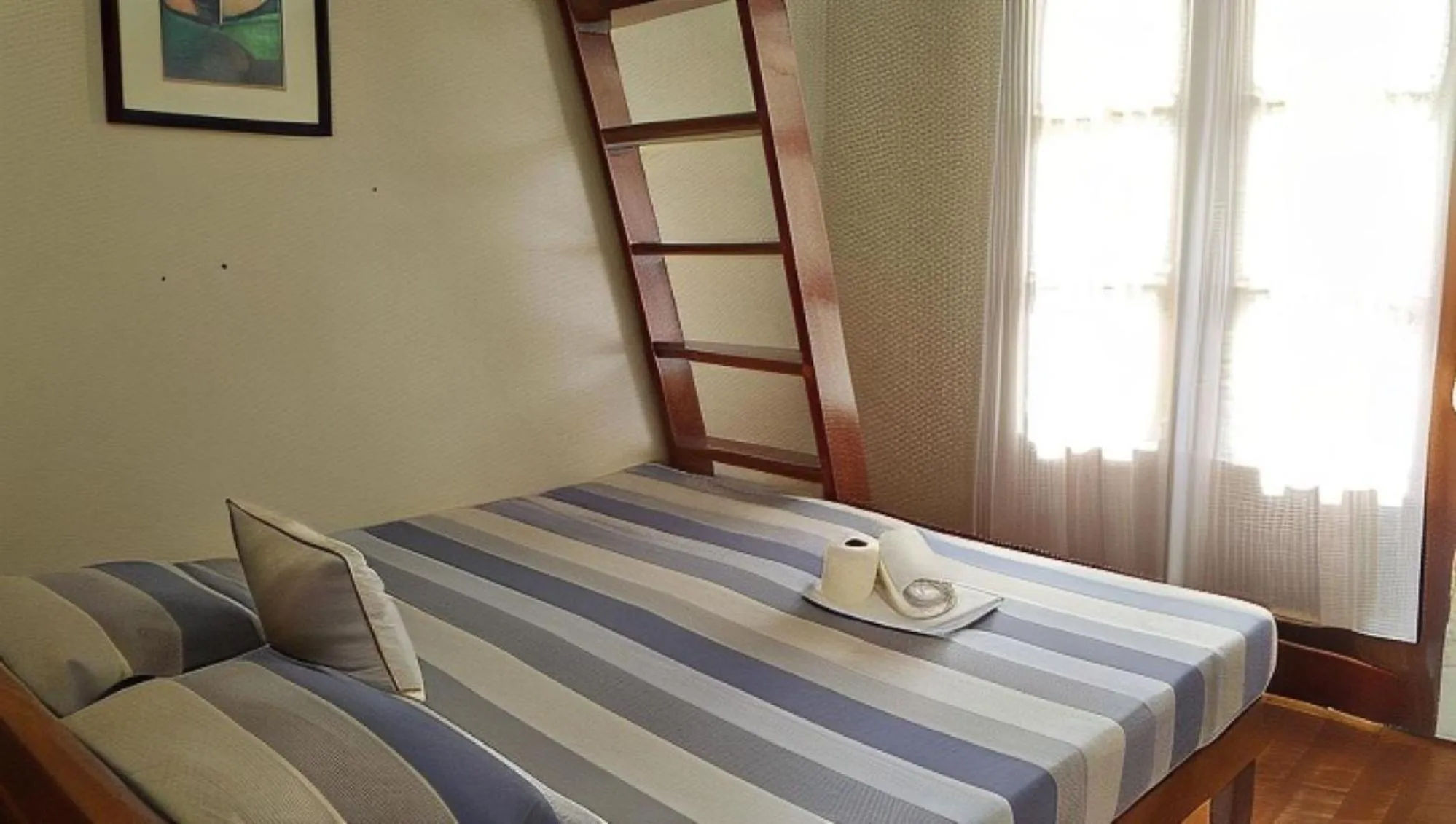 Bed in UrbanView BNKY Bed and Breakfast Palawan by RedDoorz