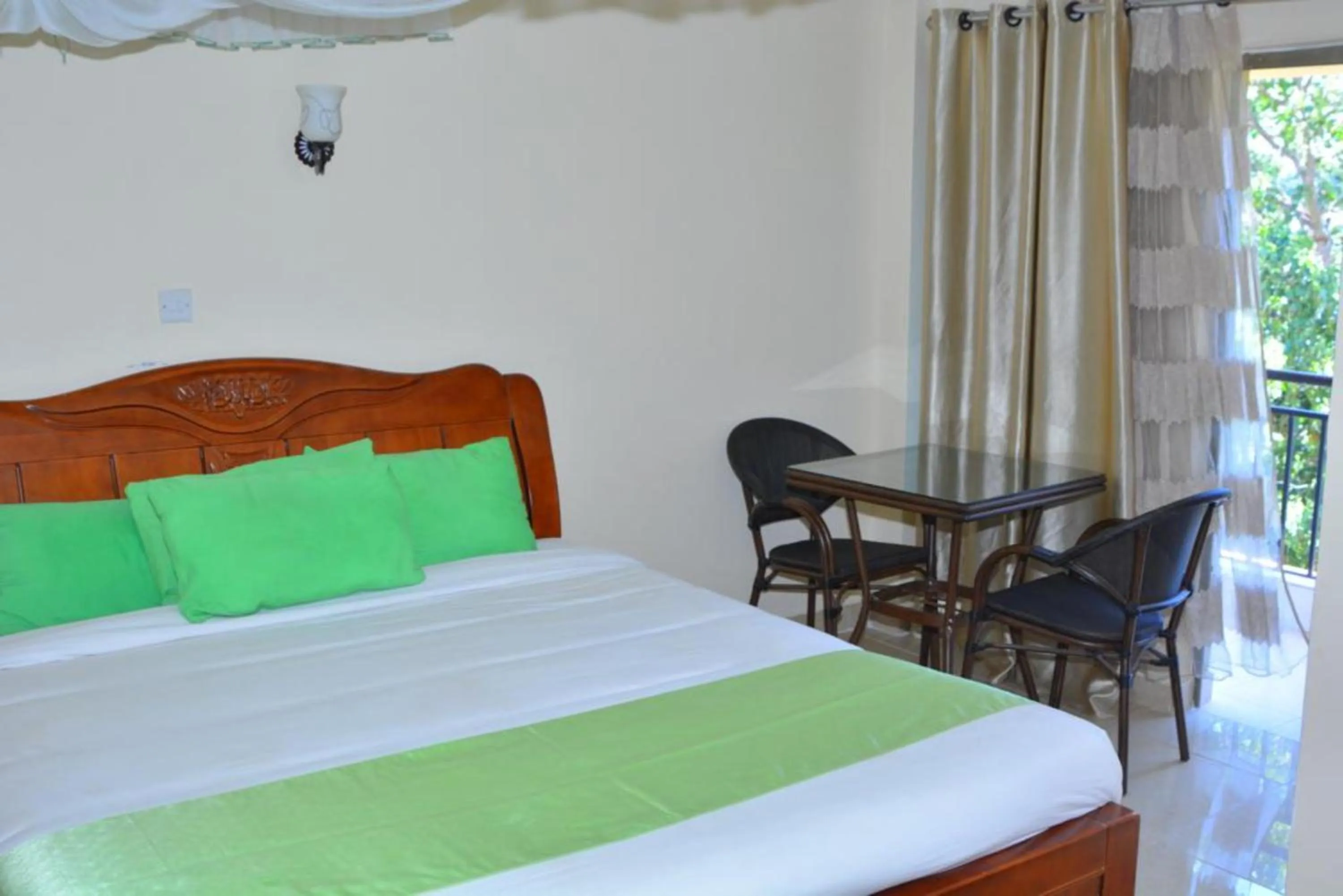 Bedroom in Omega Gardens Hotel