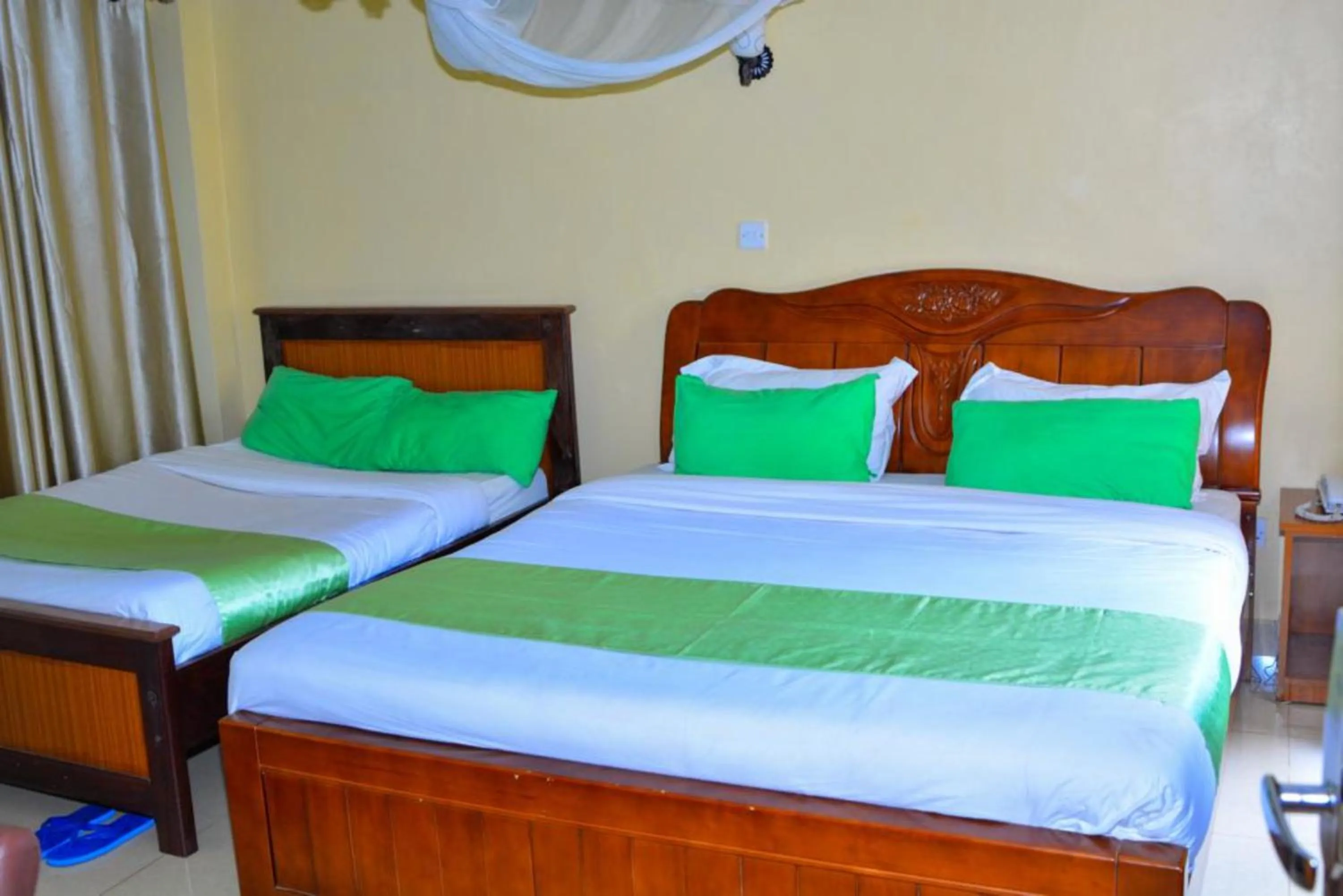 Bed in Omega Gardens Hotel
