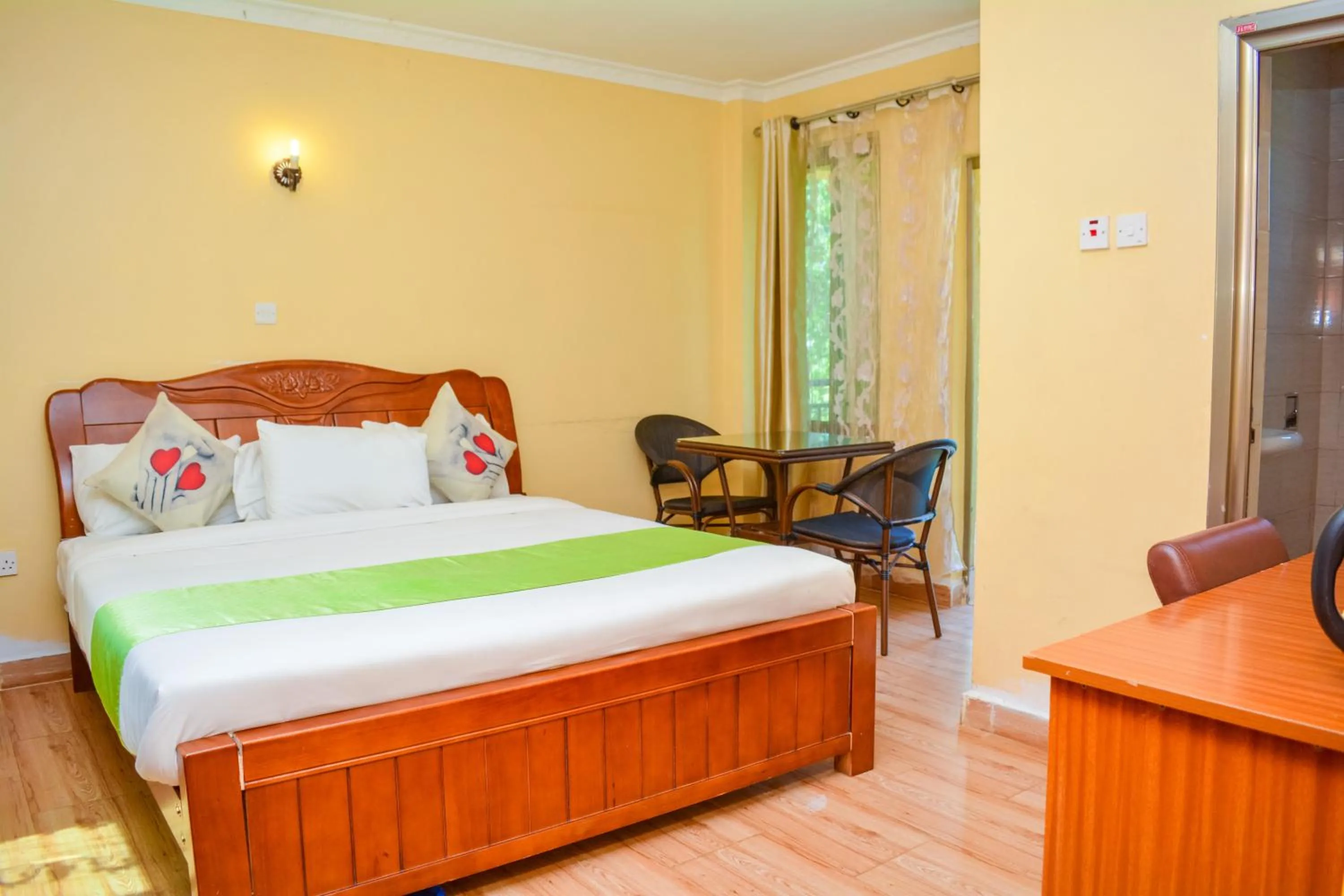 Bed in Omega Gardens Hotel