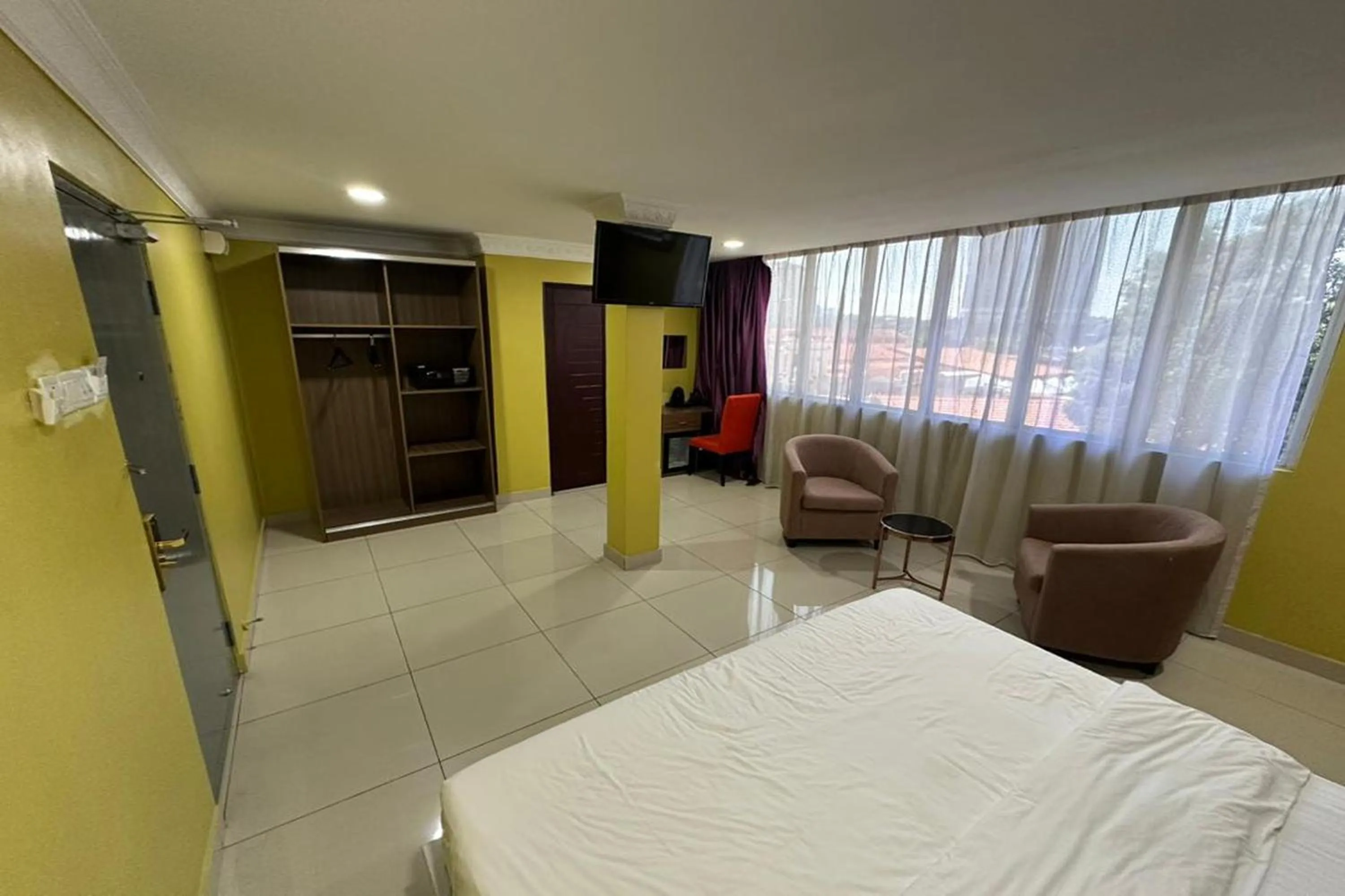 Bedroom, Bed in Poorna Hotel