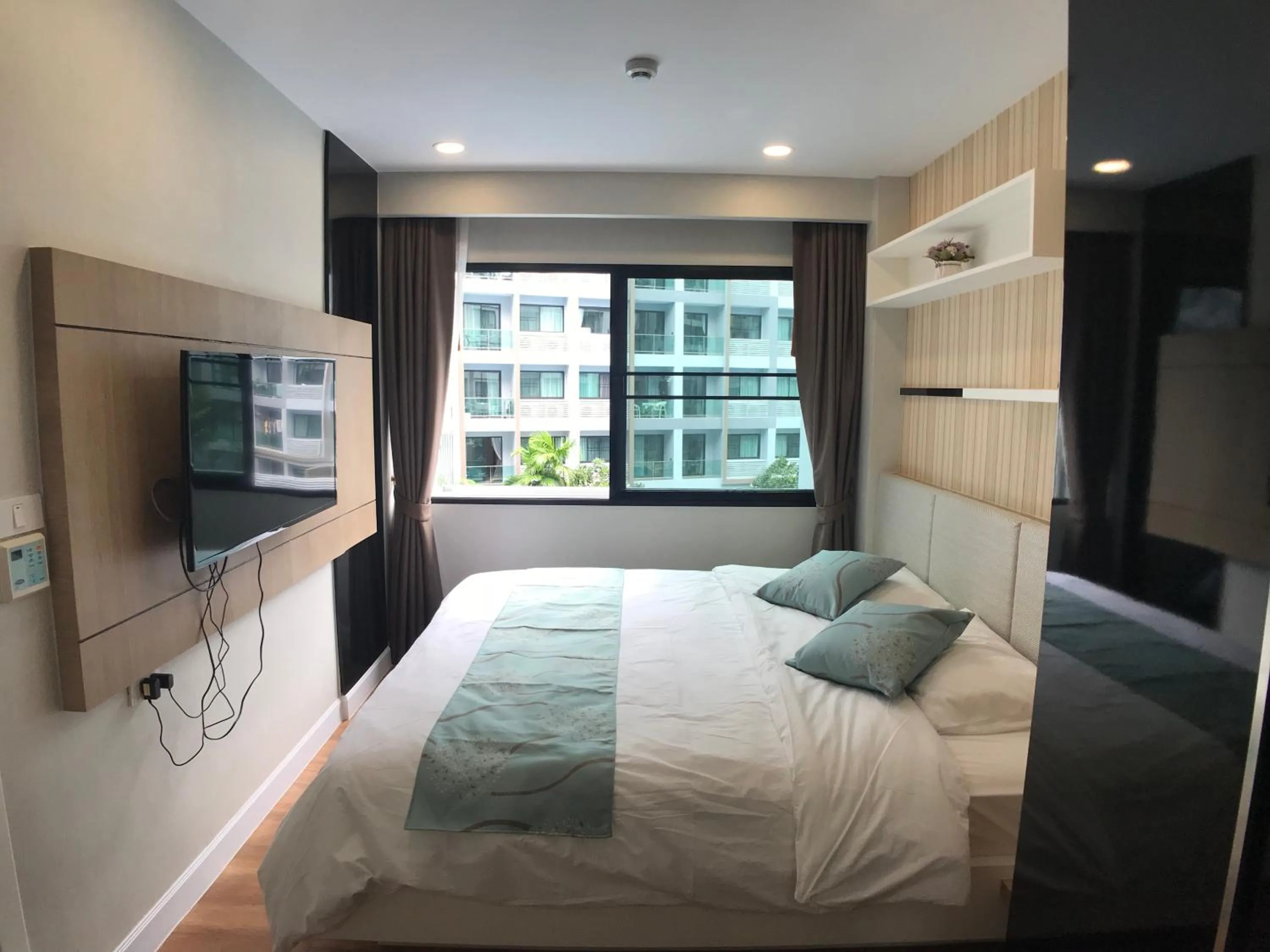 Bed in Dusit Grand Park Pool View Room