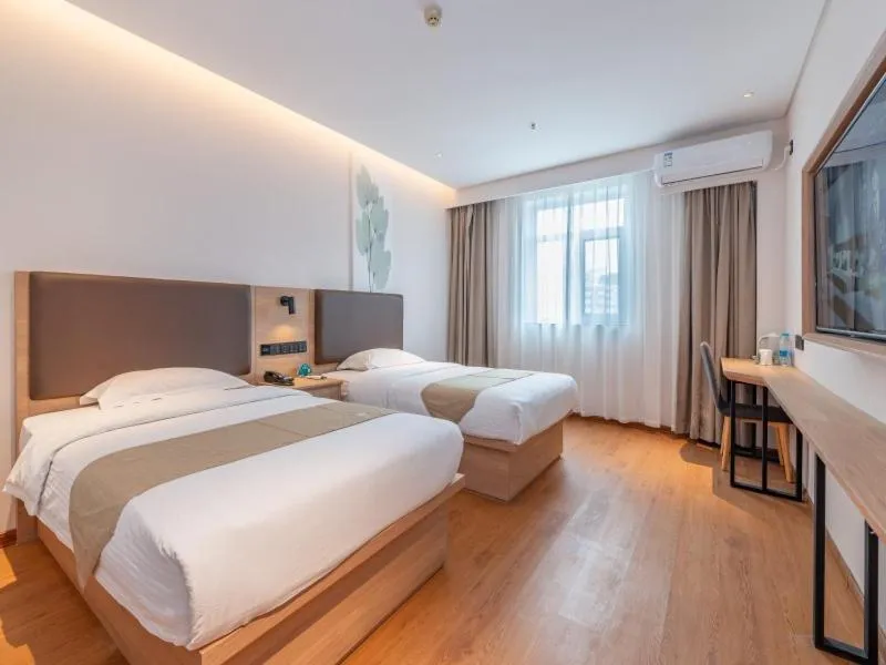 Bed in GreenTree Inn Ji‘nan Shanda Road Business Hotel