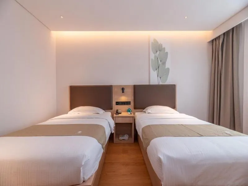 Bed in GreenTree Inn Ji‘nan Shanda Road Business Hotel