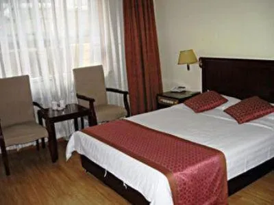 Bed in GreenTree Inn Ji‘nan Shanda Road Business Hotel
