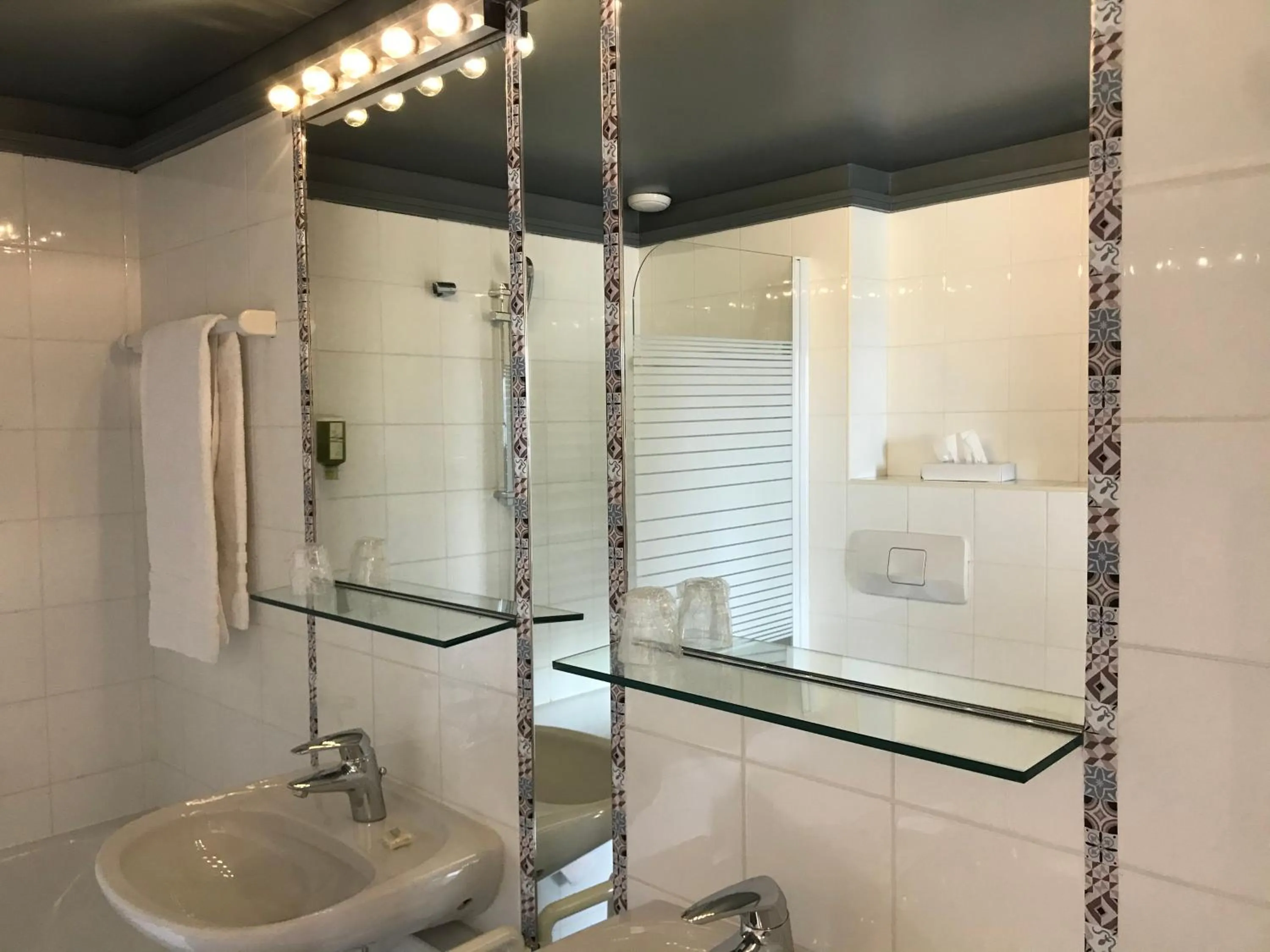 Bathroom in L'Hôtel by Hostellerie du Château