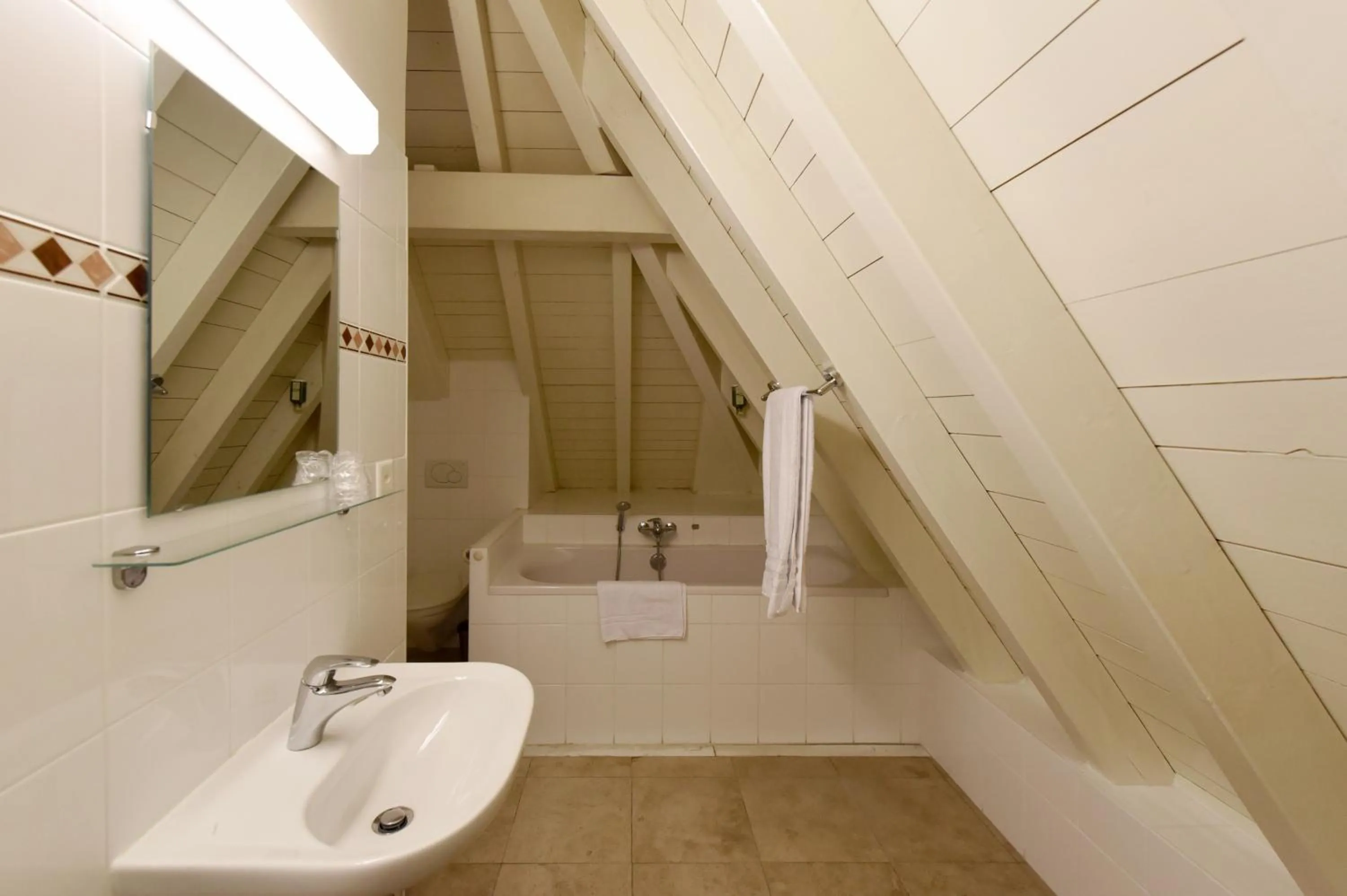 Bathroom in L'Hôtel by Hostellerie du Château